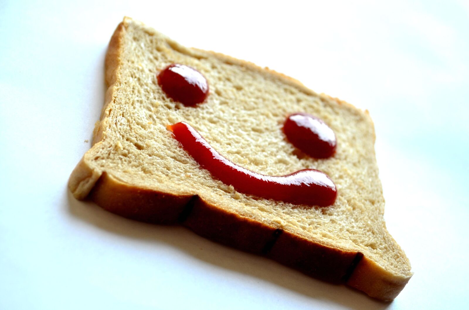 Nikon D5100 sample photo. Smile, emotion, bread, food photography