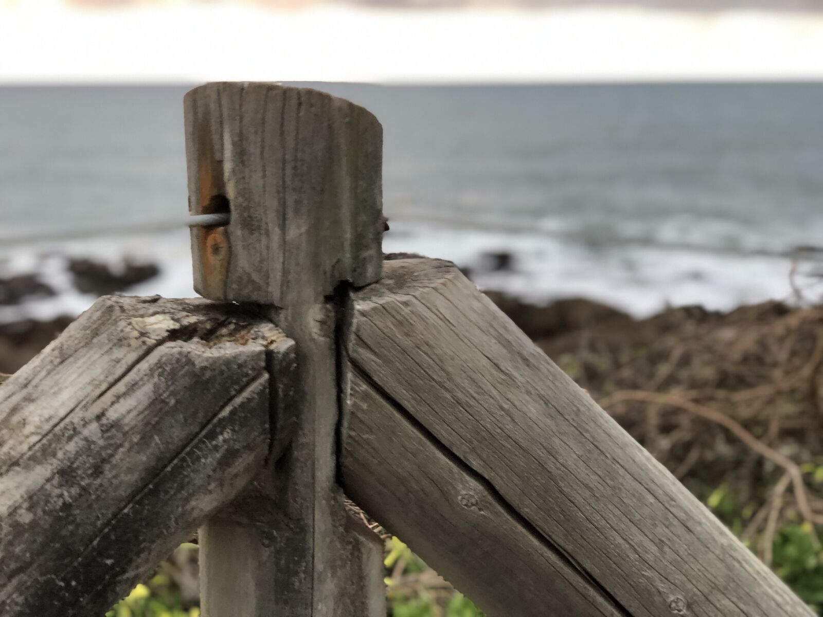 iPhone X back dual camera 6mm f/2.4 sample photo. Post, fence, ocean photography