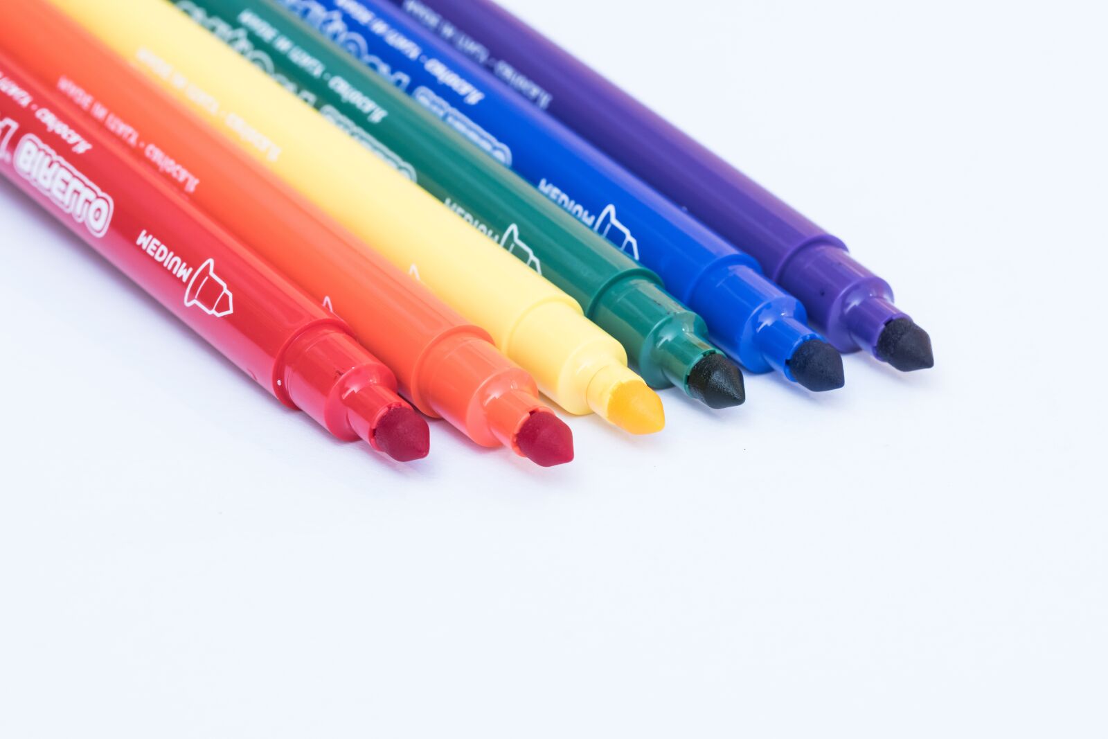 105mm F2.8 sample photo. Markers, colors, white background photography