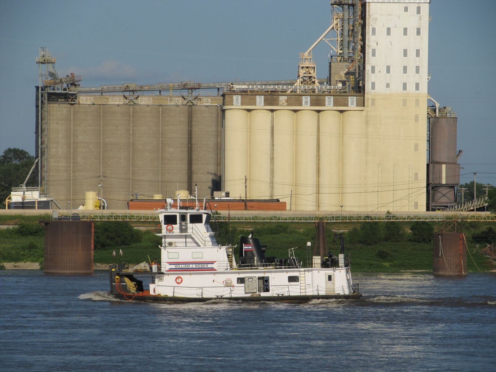 Canon PowerShot SX130 IS sample photo. Tugboat, river, grain elevator photography