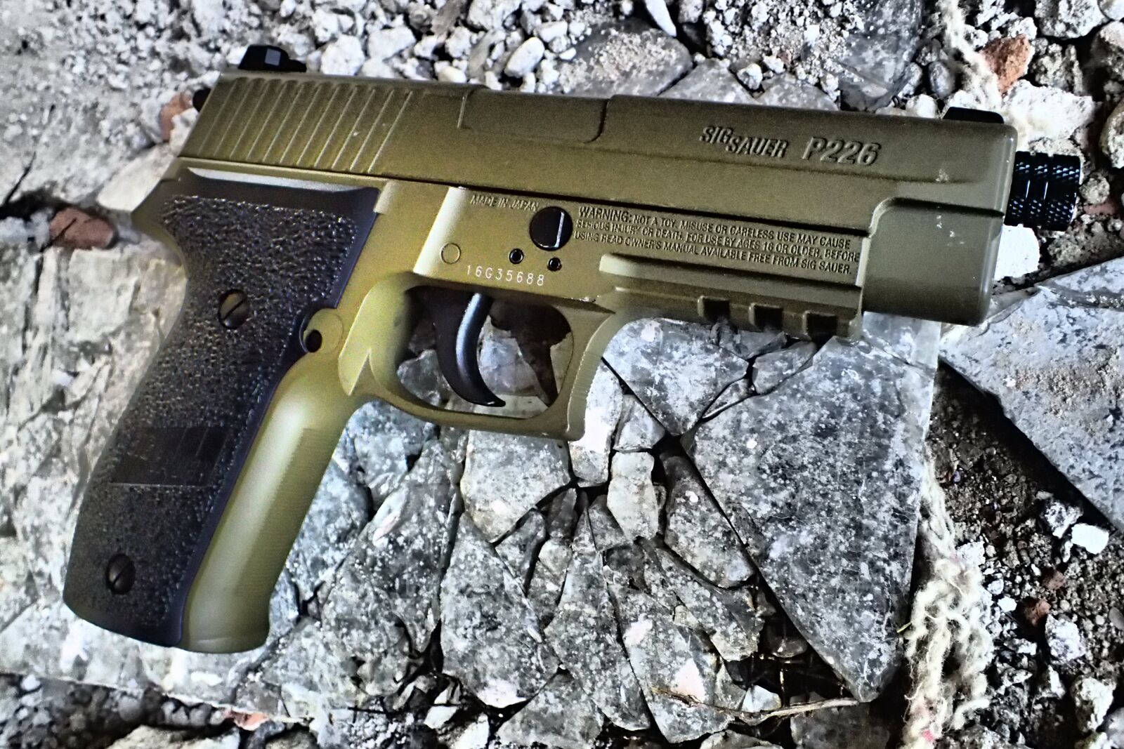 Olympus TG-4 sample photo. Weapon, a pistol shaped photography