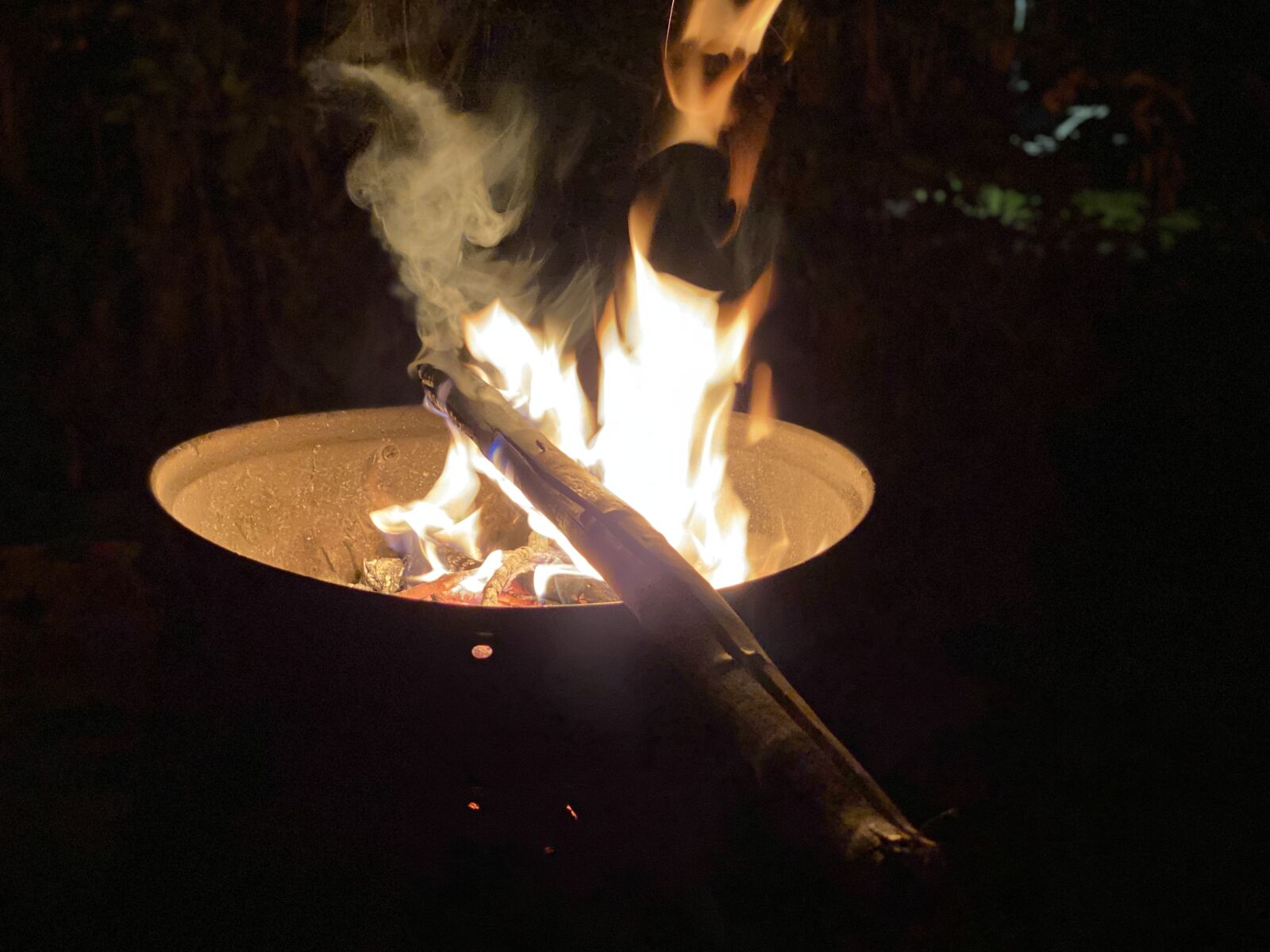iPhone 11 Pro Max back dual camera 6mm f/2 sample photo. Camping, fire, campfire photography