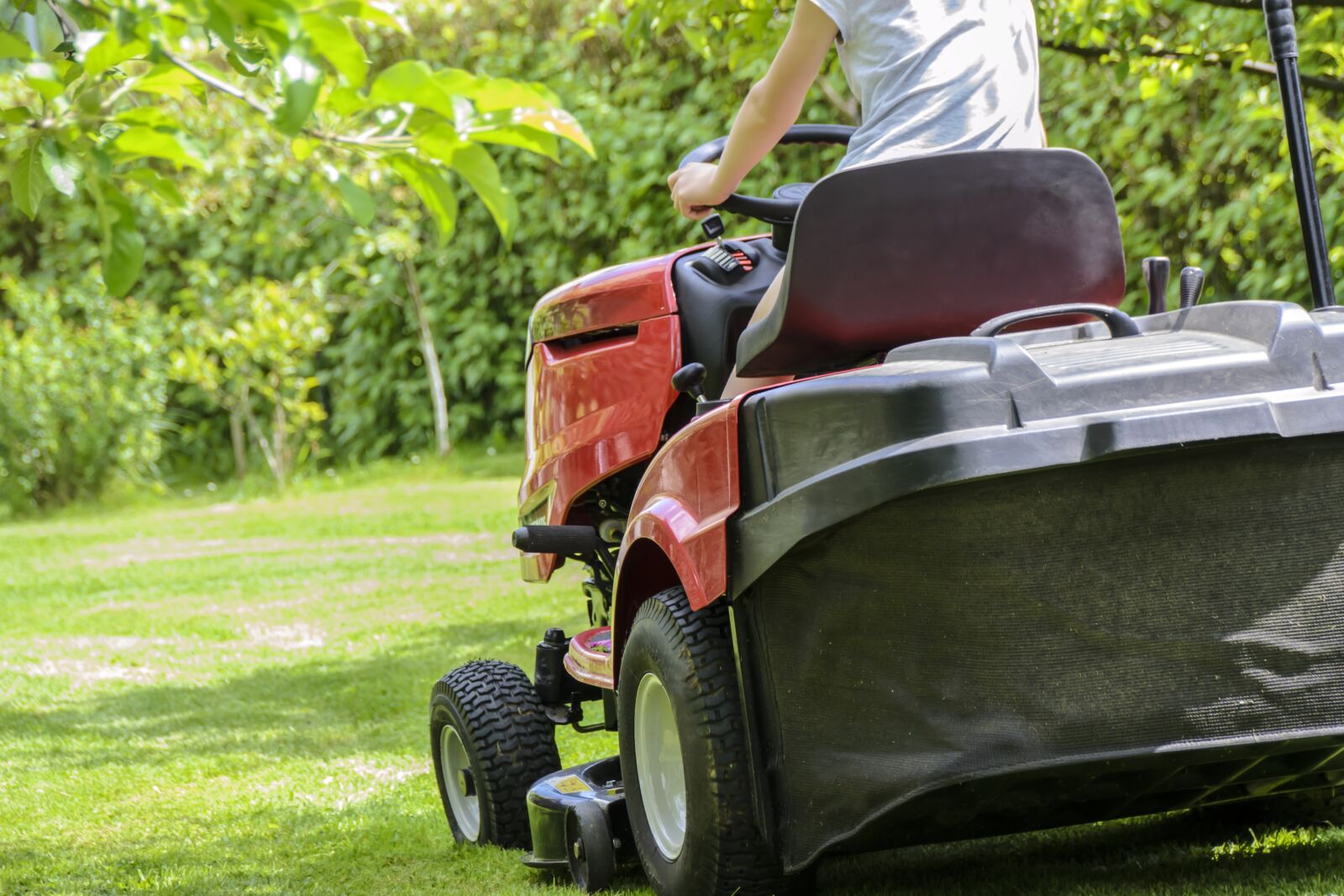 Nikon D3100 sample photo. Mowing the grass, garden photography