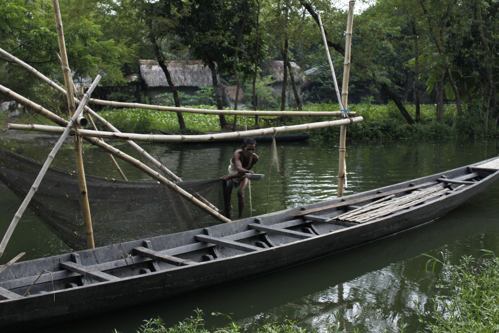 Canon EOS 500D (EOS Rebel T1i / EOS Kiss X3) sample photo. Bangladesh, boat, canal, fisherman photography