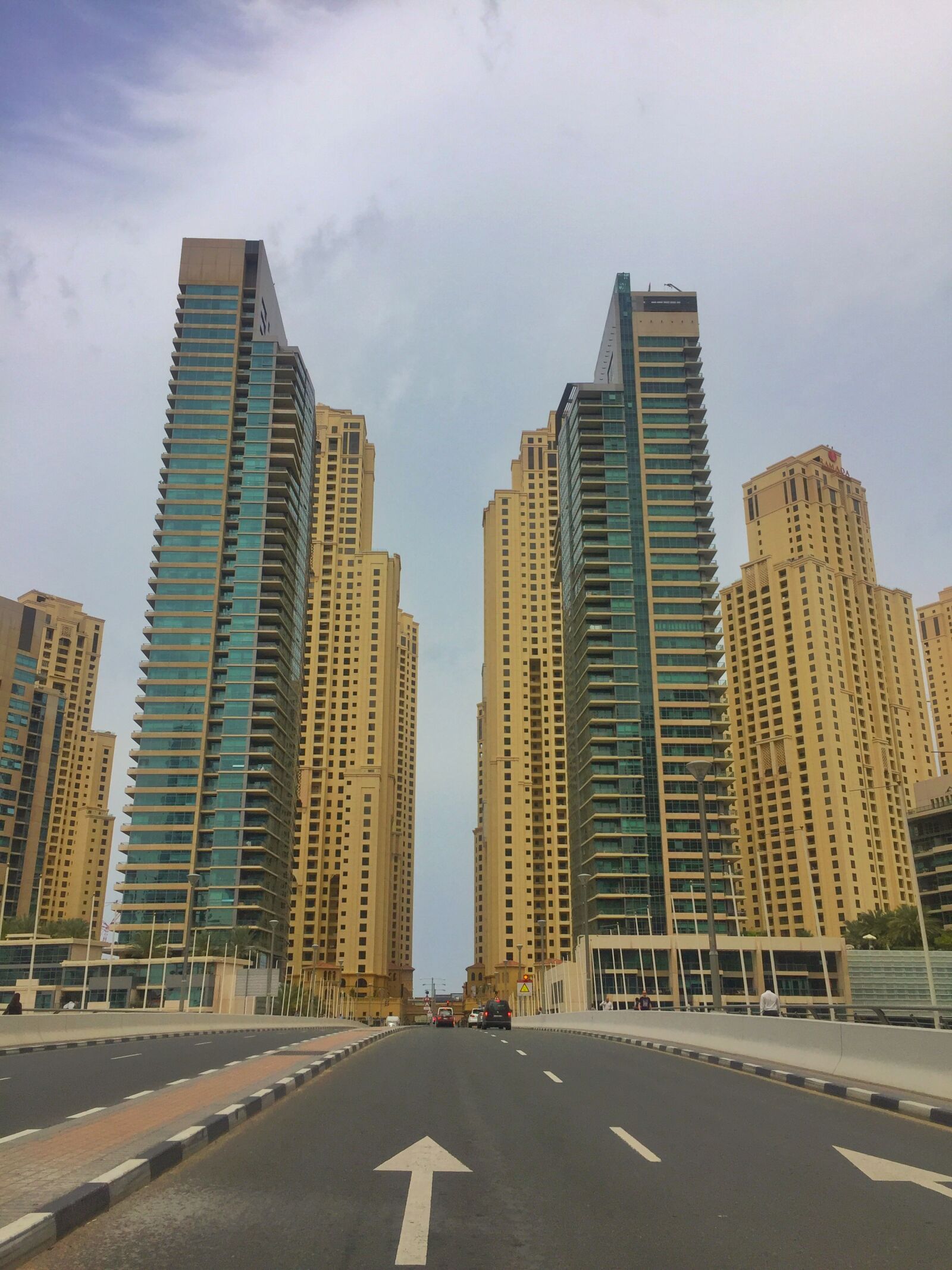 Apple iPhone 6 sample photo. Arrow, buildings, city, cloud photography