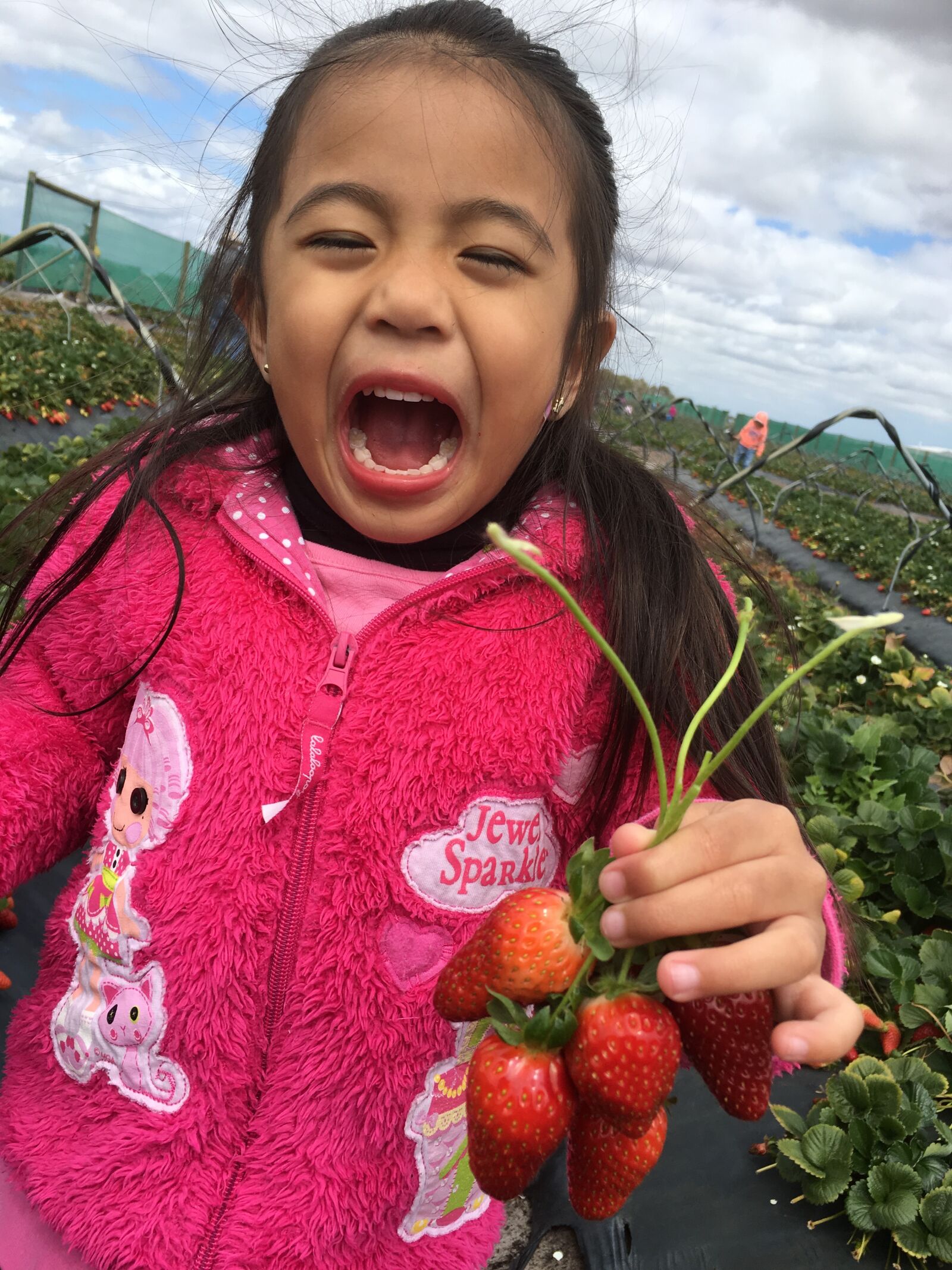 Apple iPhone 6s Plus sample photo. Kid smiling picking strawberries photography