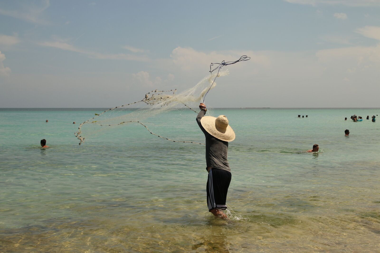 Canon EOS 70D sample photo. Fisherman, beach, fish photography