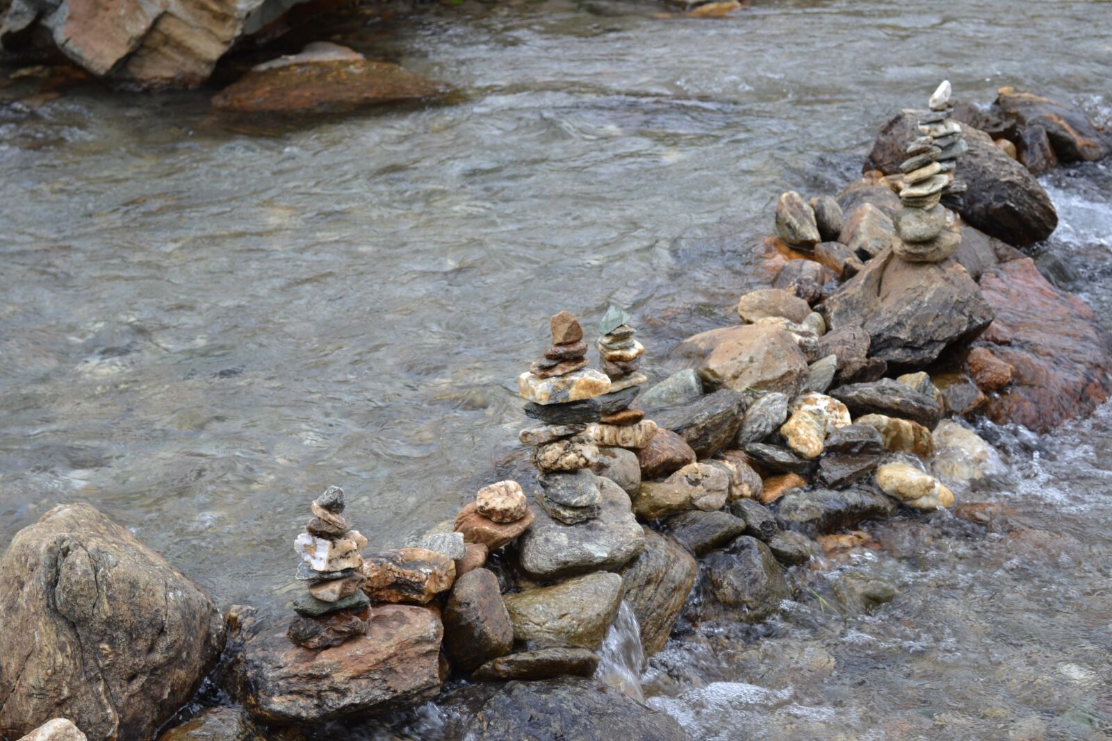 Nikon D3100 sample photo. Stones, water, fluent photography