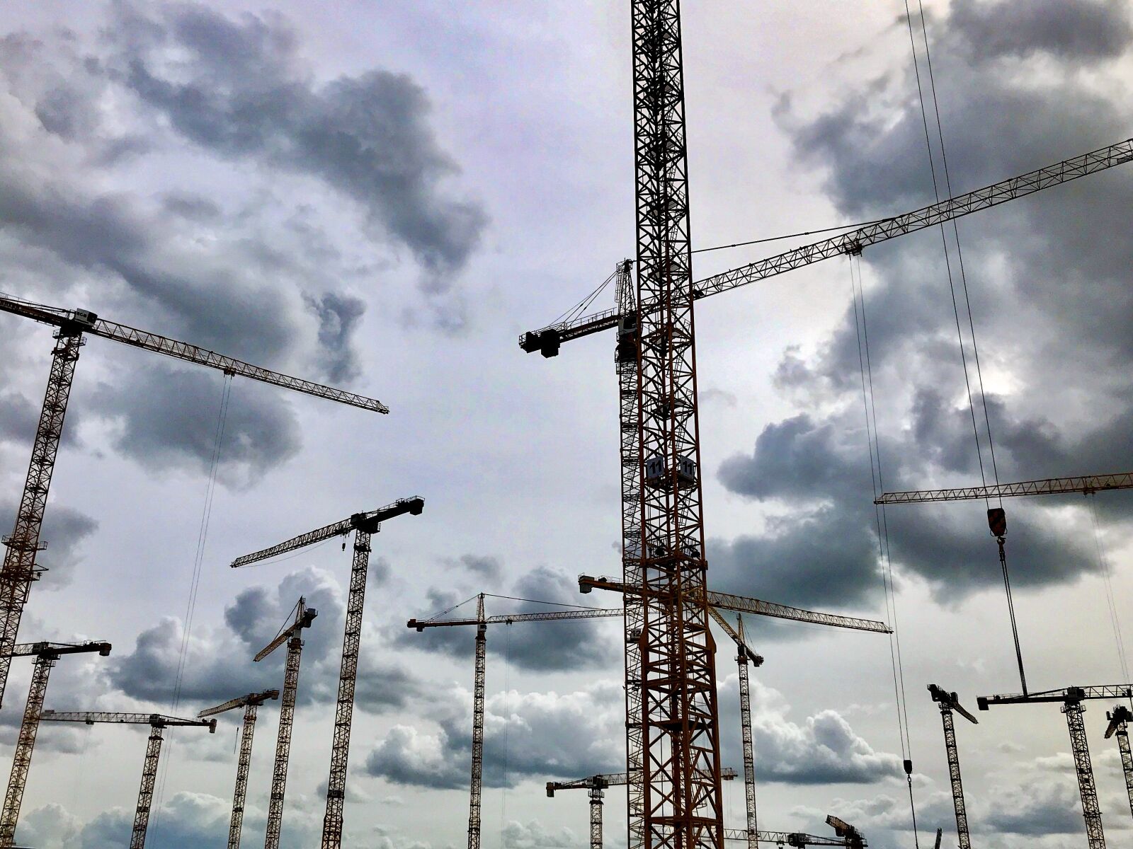 iPhone 7 back camera 3.99mm f/1.8 sample photo. Cranes, sky, site photography