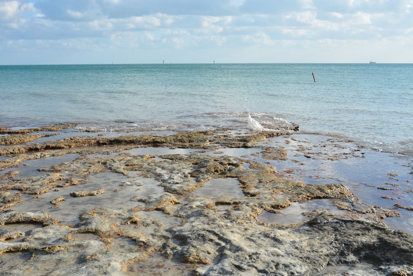Nikon D7100 sample photo. Beach, rock, clouds photography