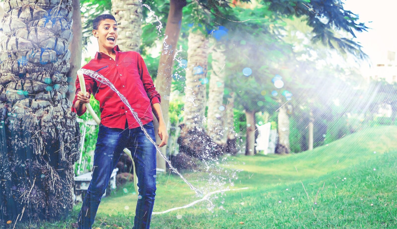 Nikon D5100 sample photo. Man, garden, water photography