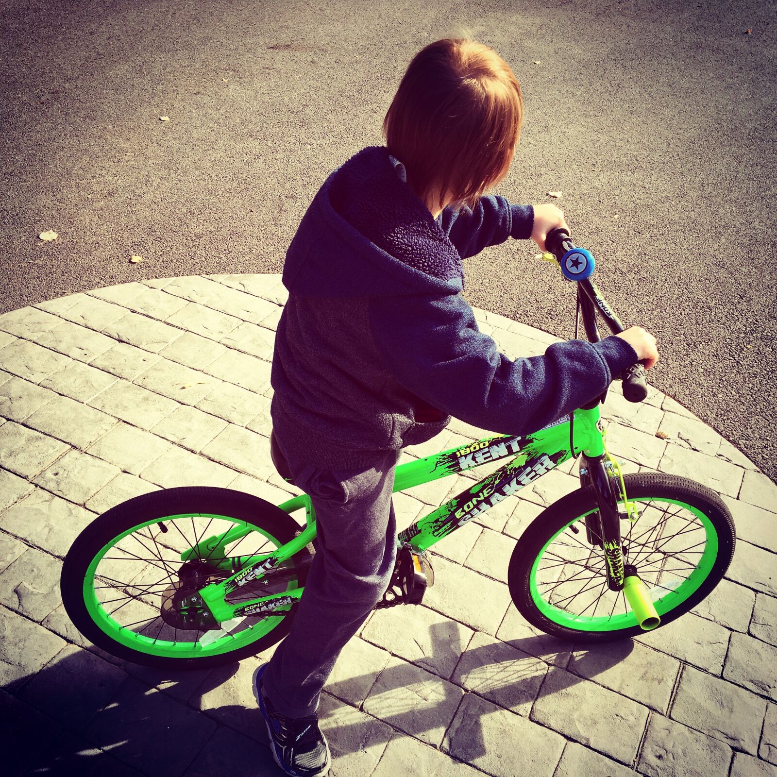 iPhone 6s back camera 4.15mm f/2.2 sample photo. Boy, riding, bike, at photography