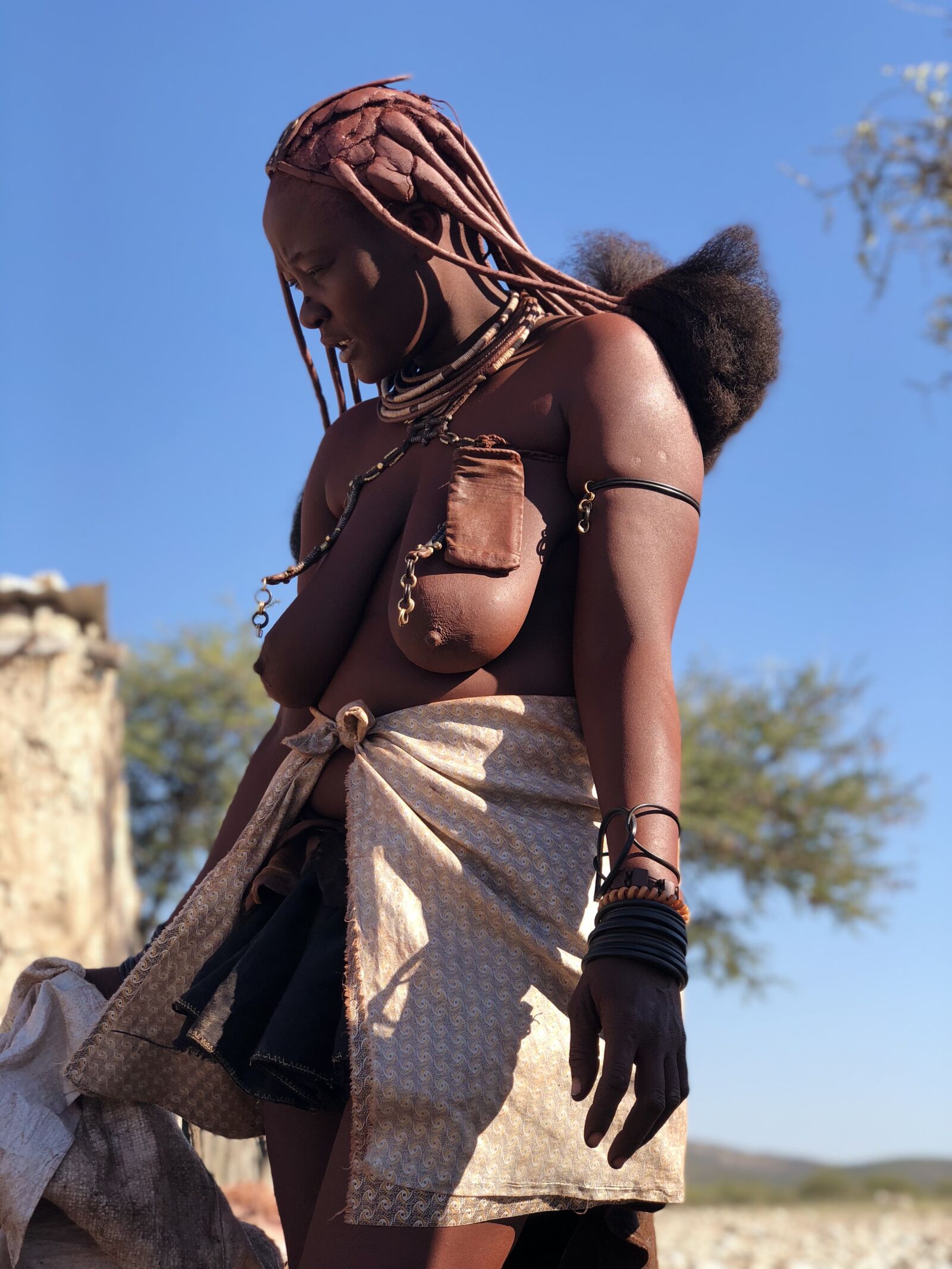 iPhone X back dual camera 6mm f/2.4 sample photo. Himba, namibia, woman photography