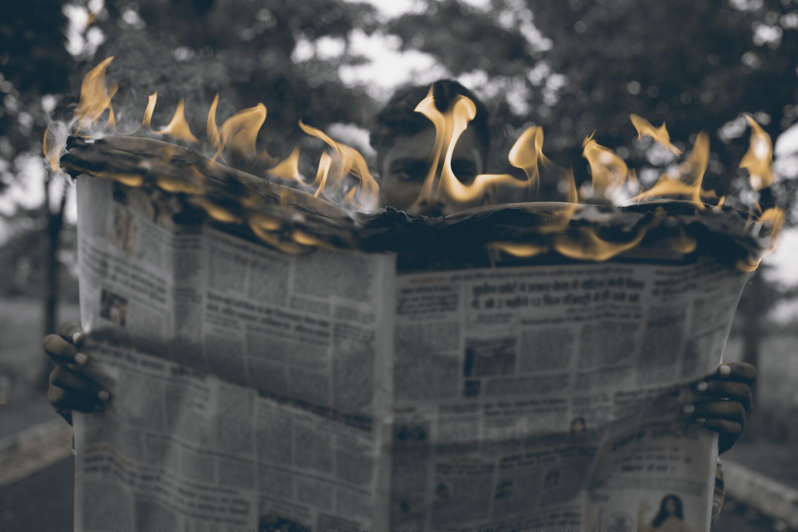 Nikon D3300 sample photo. Man, reading, burning photography