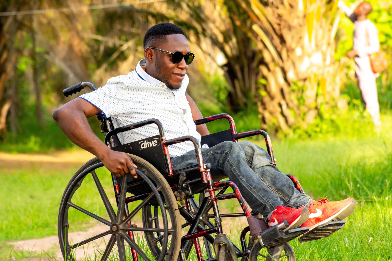 Canon EF75-300mm f/4-5.6 sample photo. Man on a wheelchair photography