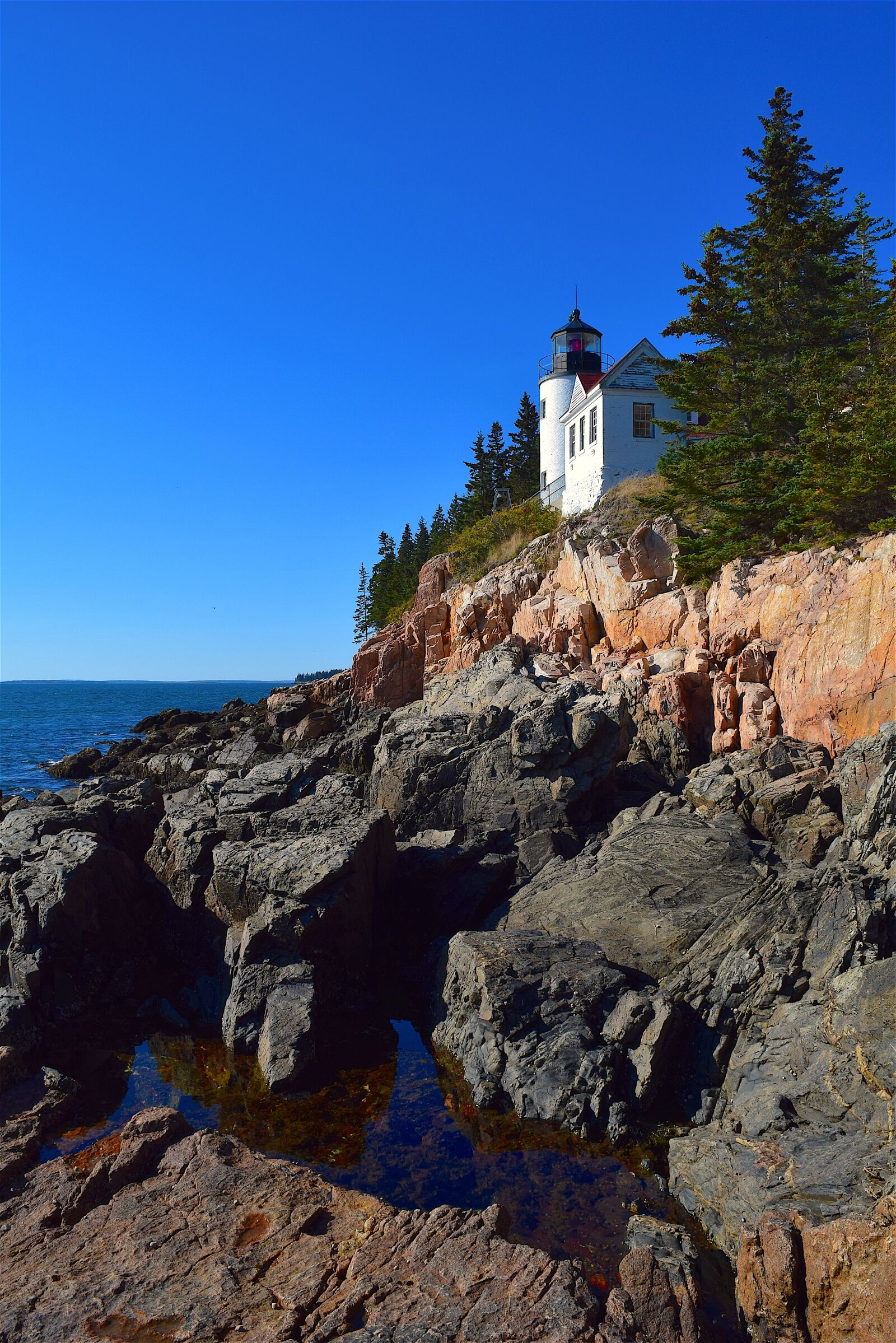 Nikon D3300 sample photo. Lighthouse, rocks, trees photography