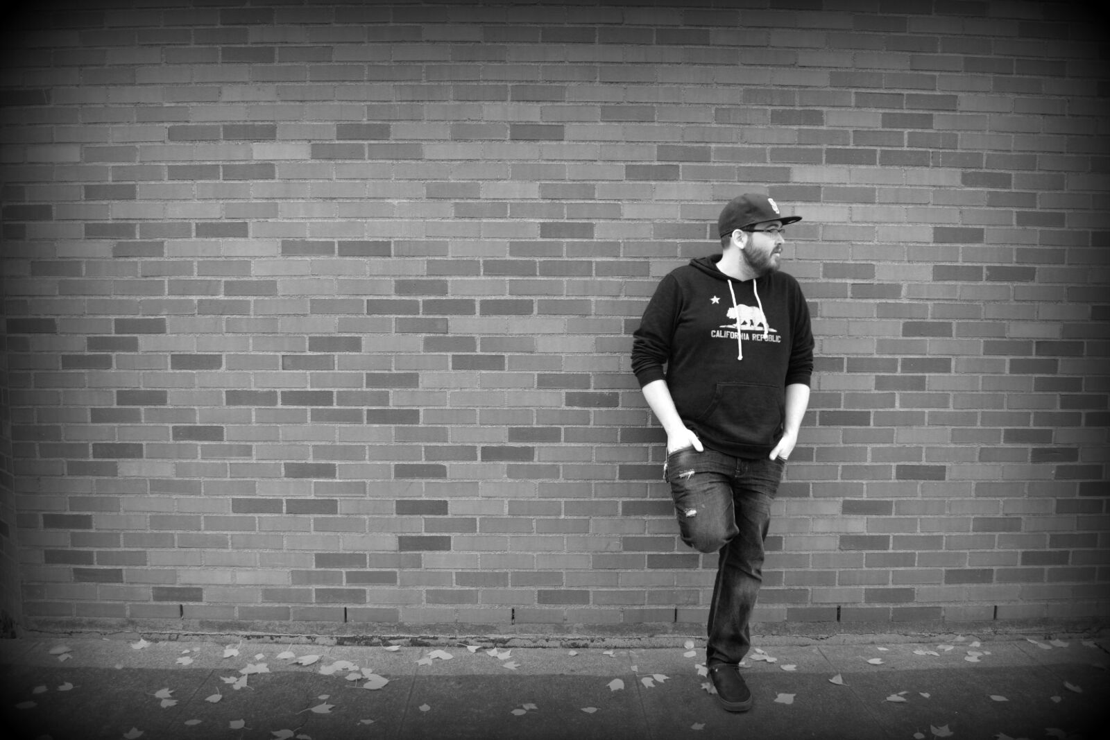 Nikon D3100 sample photo. Brick, man, hat photography