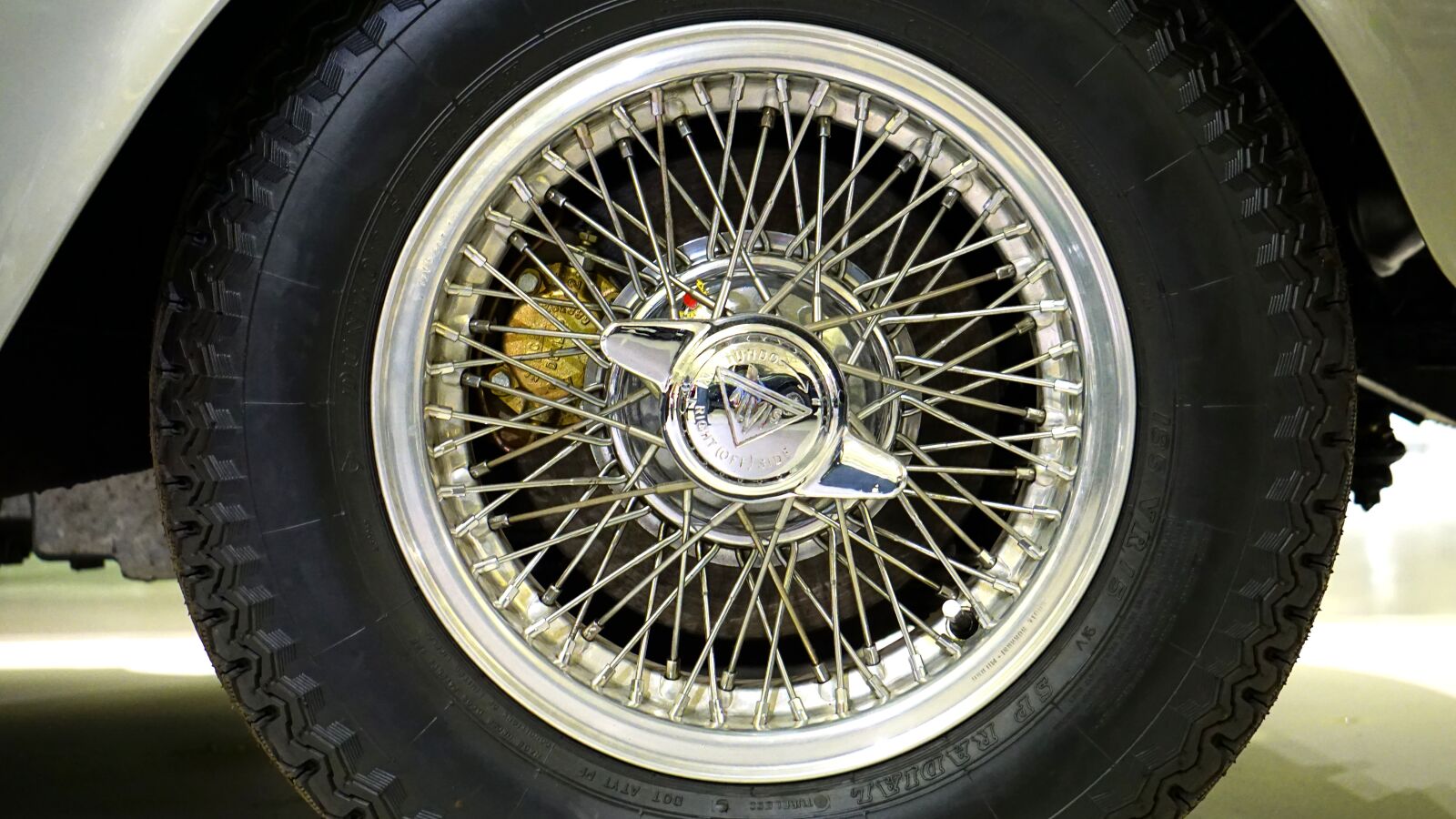 Sony E 55-210mm F4.5-6.3 OSS sample photo. Wire wheel, car, wheel photography