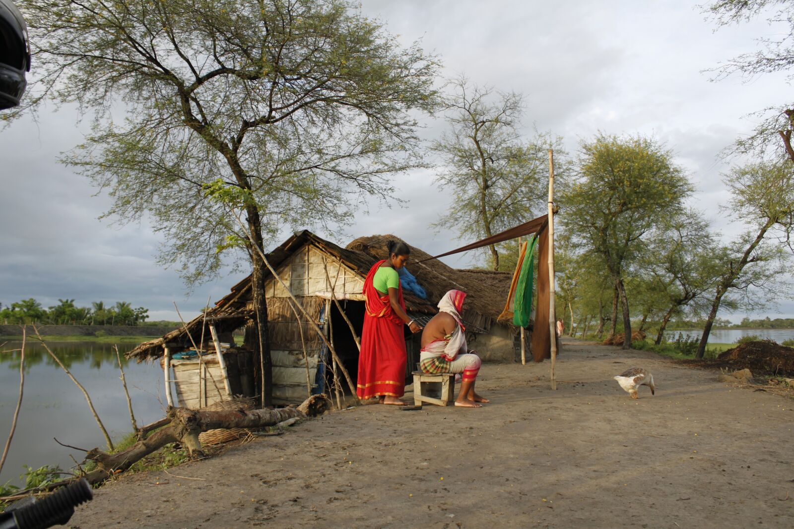 Canon EOS 500D (EOS Rebel T1i / EOS Kiss X3) sample photo. Bangladesh, canal, fisherman, flower photography