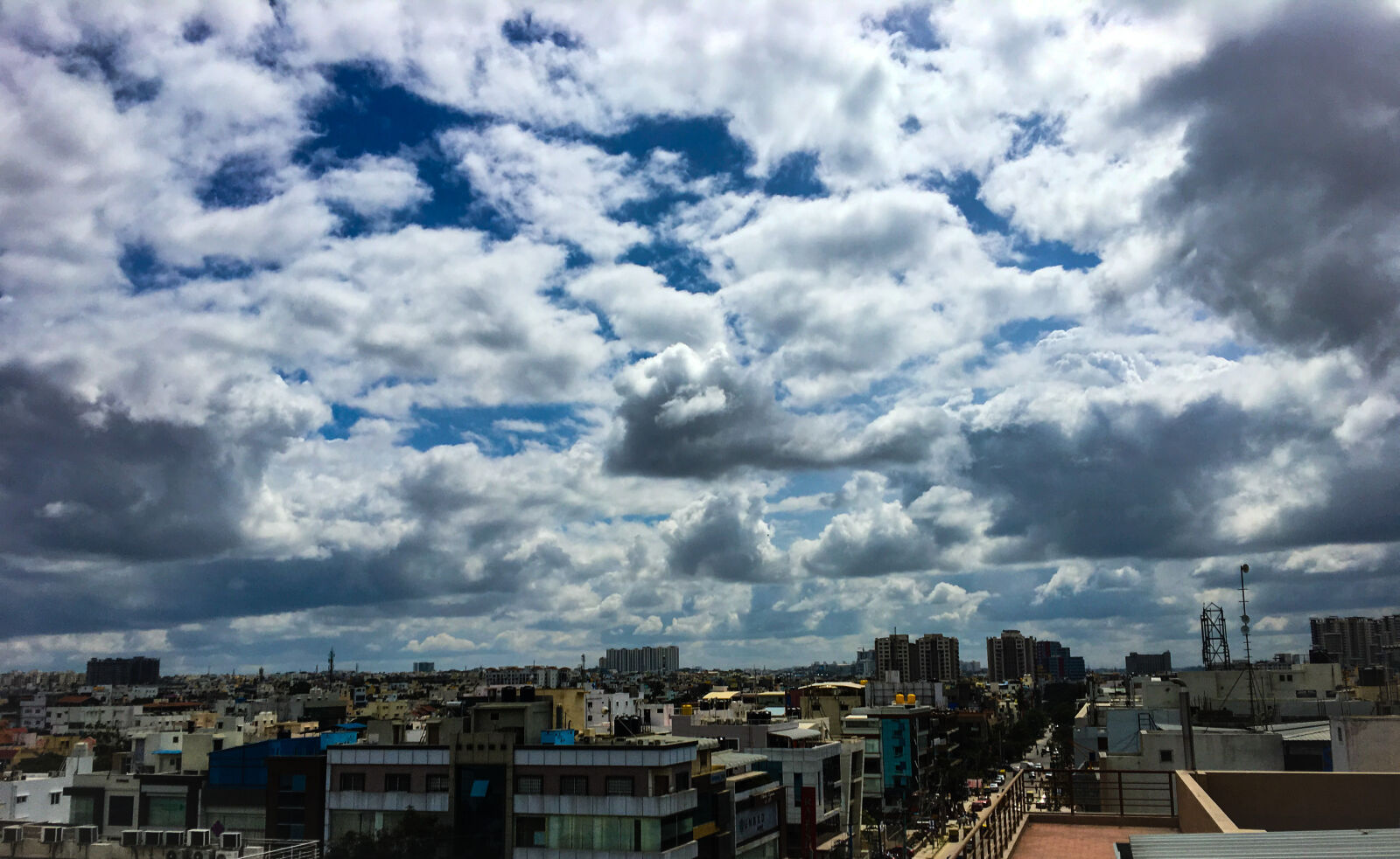 iPhone 6s back camera 4.15mm f/2.2 sample photo. Blue, sky, building, cityview photography