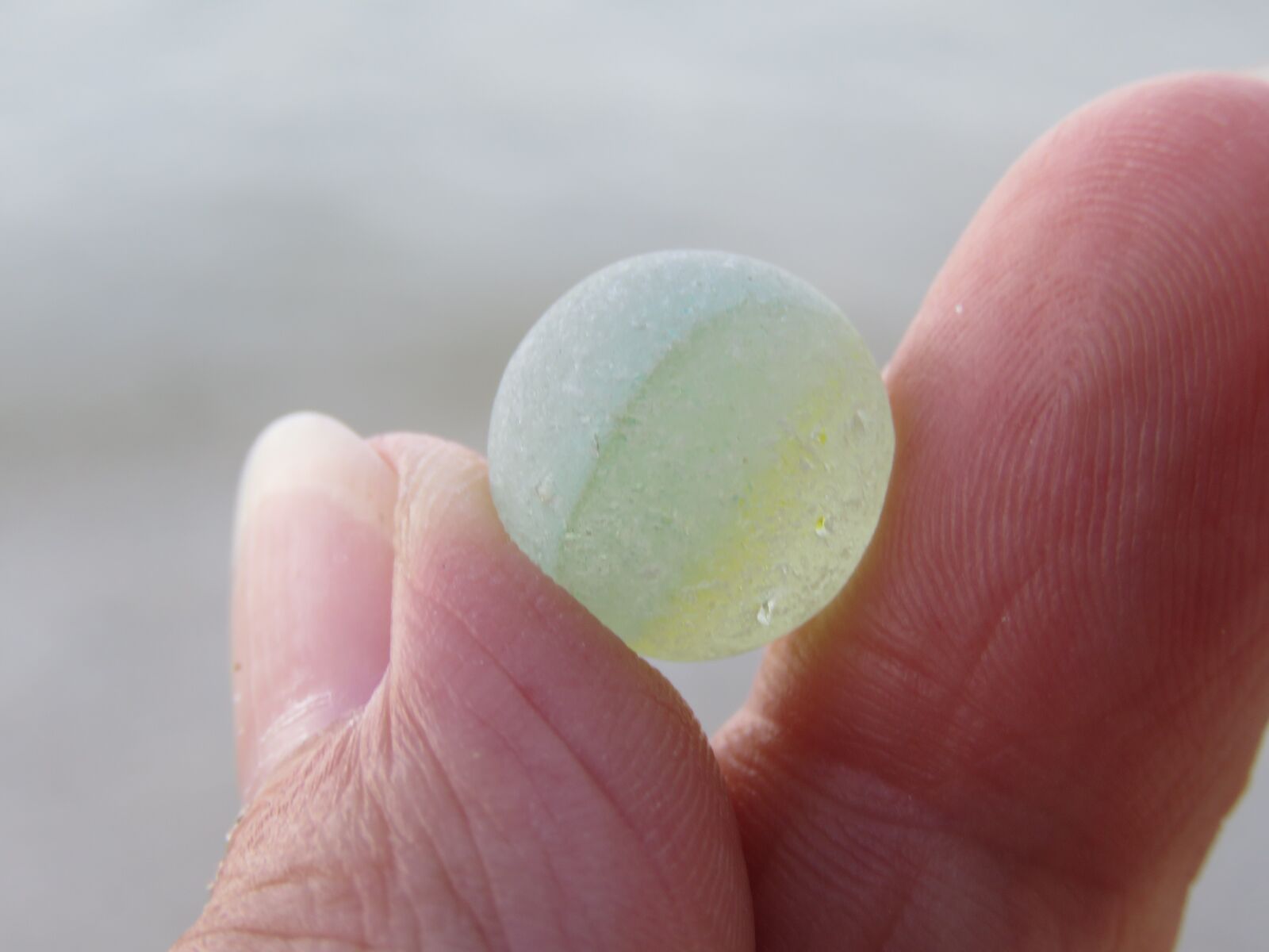 Canon PowerShot SX60 HS sample photo. Zeeglas, marble, sea photography