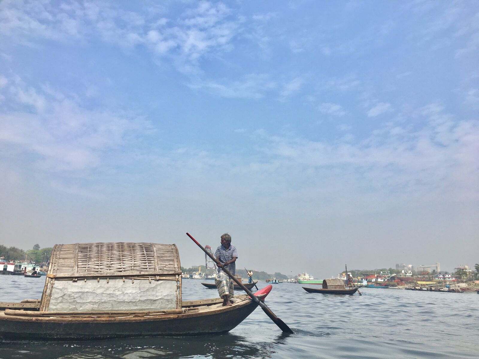 Apple iPhone 6s sample photo. River, clean sky, boatman photography