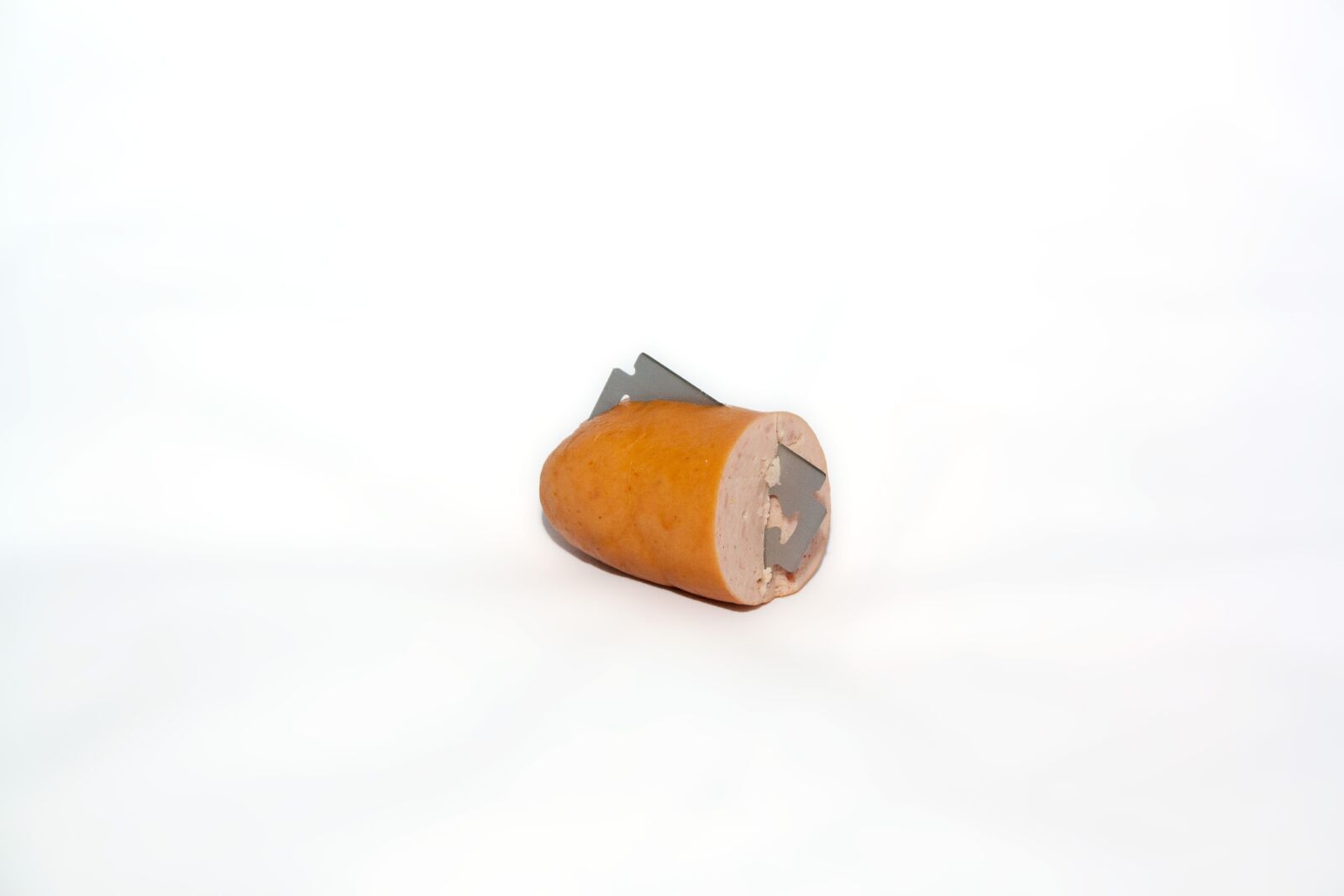 Canon EF-S 18-55mm F3.5-5.6 II sample photo. Sausage, razor blades, poison photography