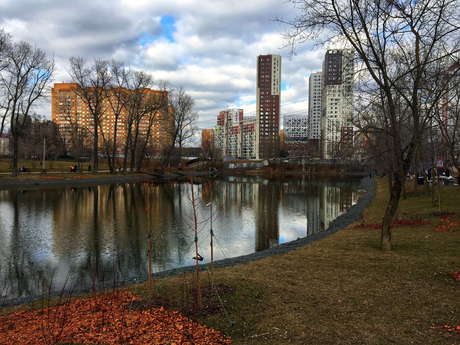 Apple iPhone 6s sample photo. Pond, skyscrapers, at home photography