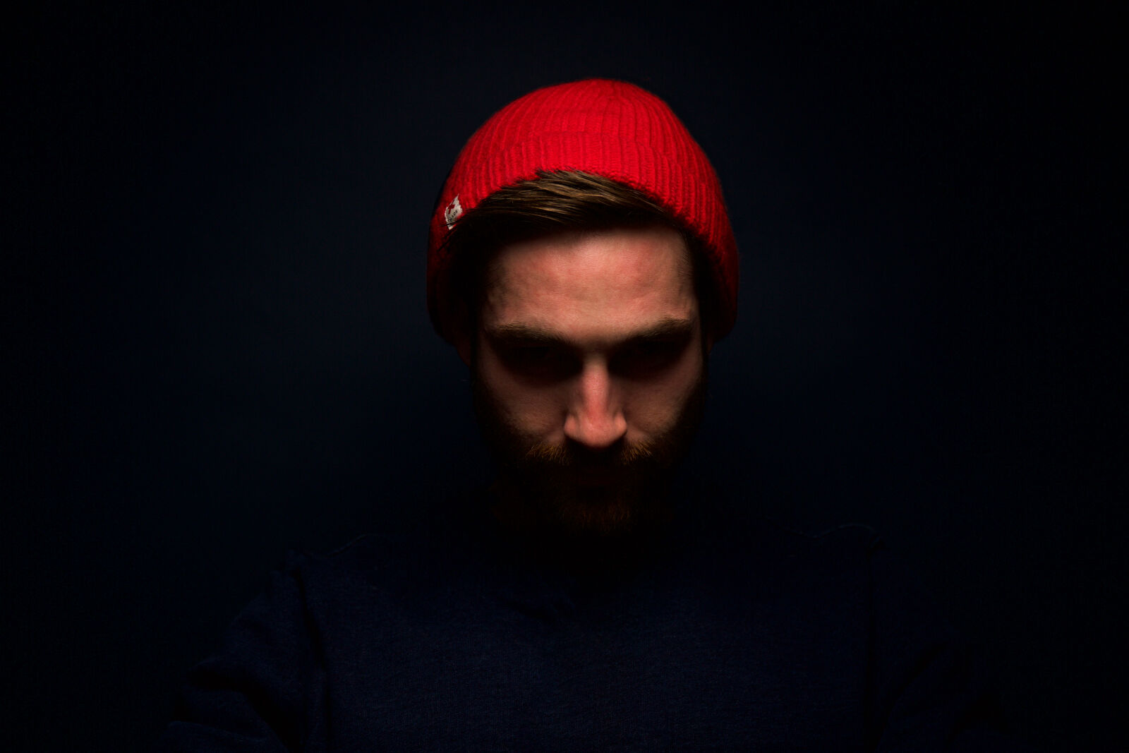 Canon EF 24-70mm F4L IS USM sample photo. Adult, beanie, dark, emotion photography