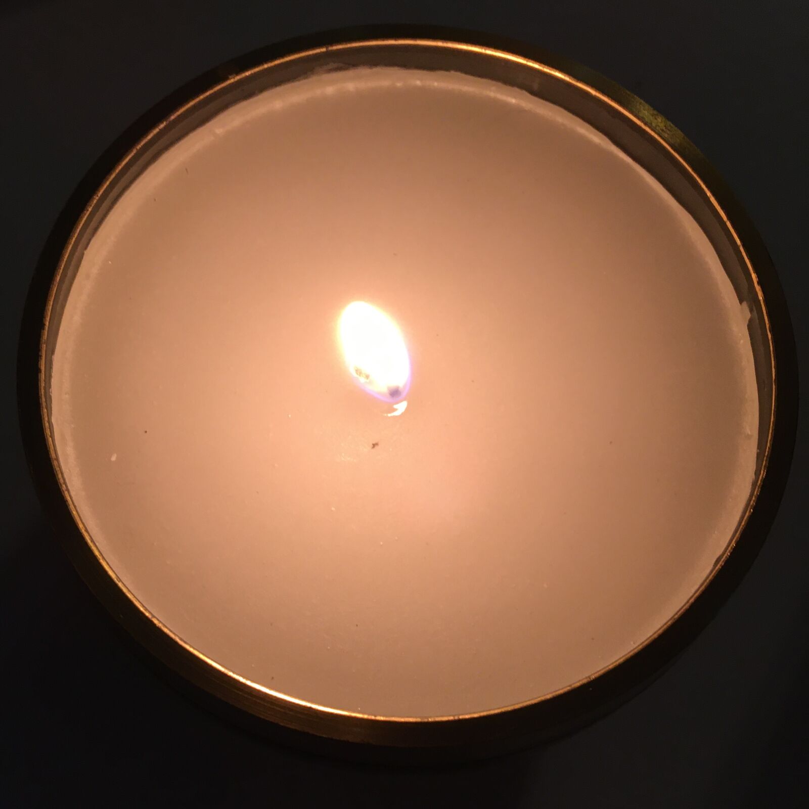 iPhone SE back camera 4.15mm f/2.2 sample photo. Candle, flame, meditation photography