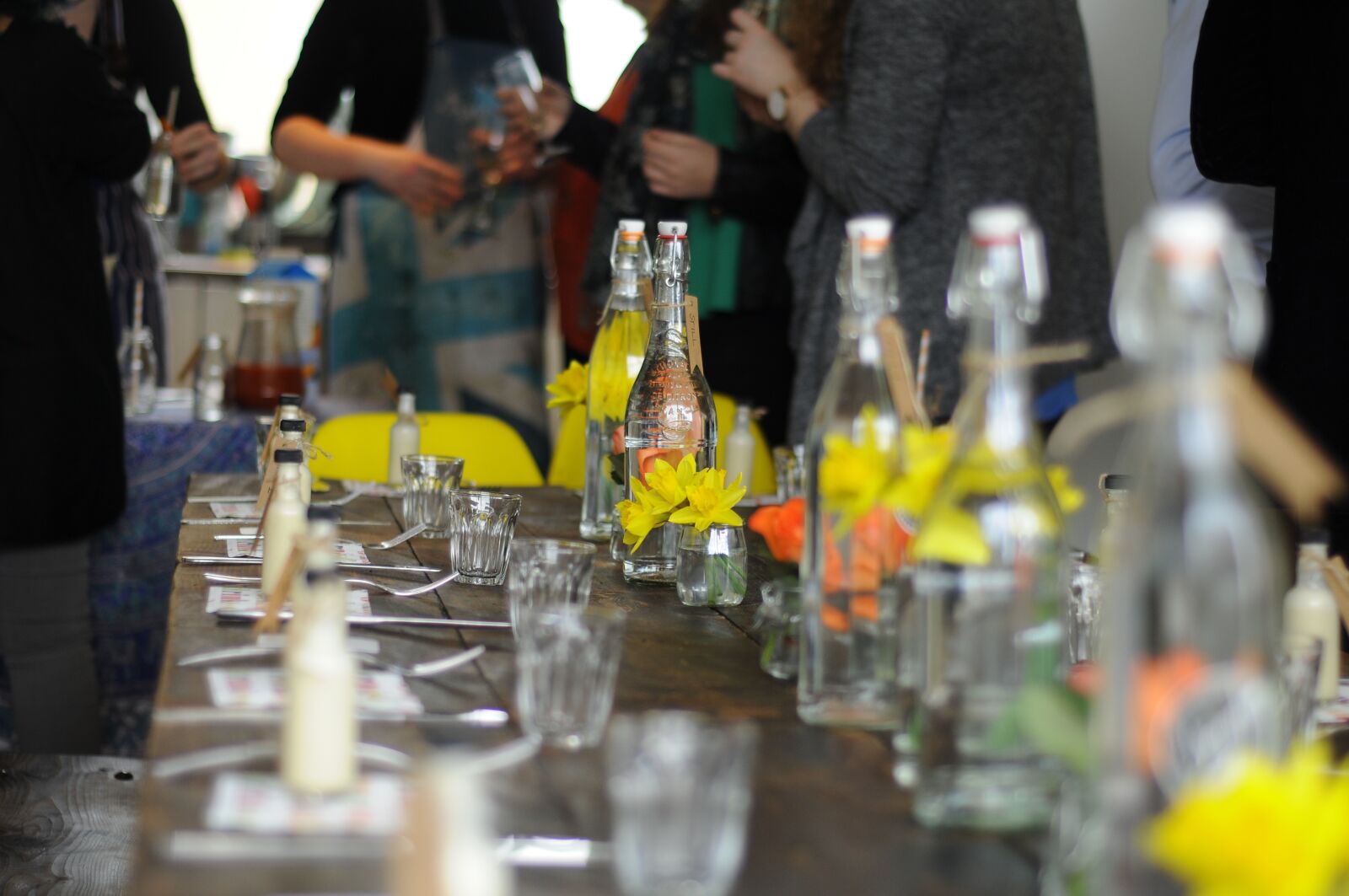 Nikon D300 sample photo. Bottle, bottles, crowd, daffodils photography