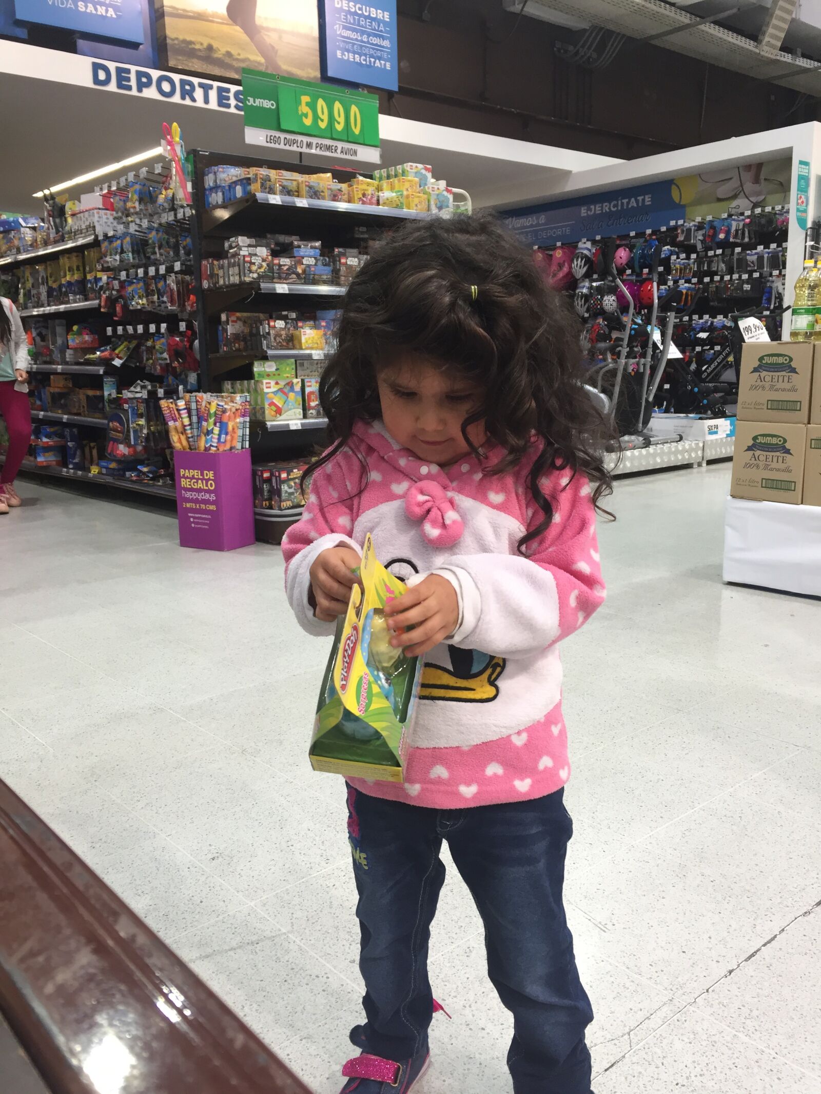 iPhone 6 back camera 4.15mm f/2.2 sample photo. Girl, market, toy photography