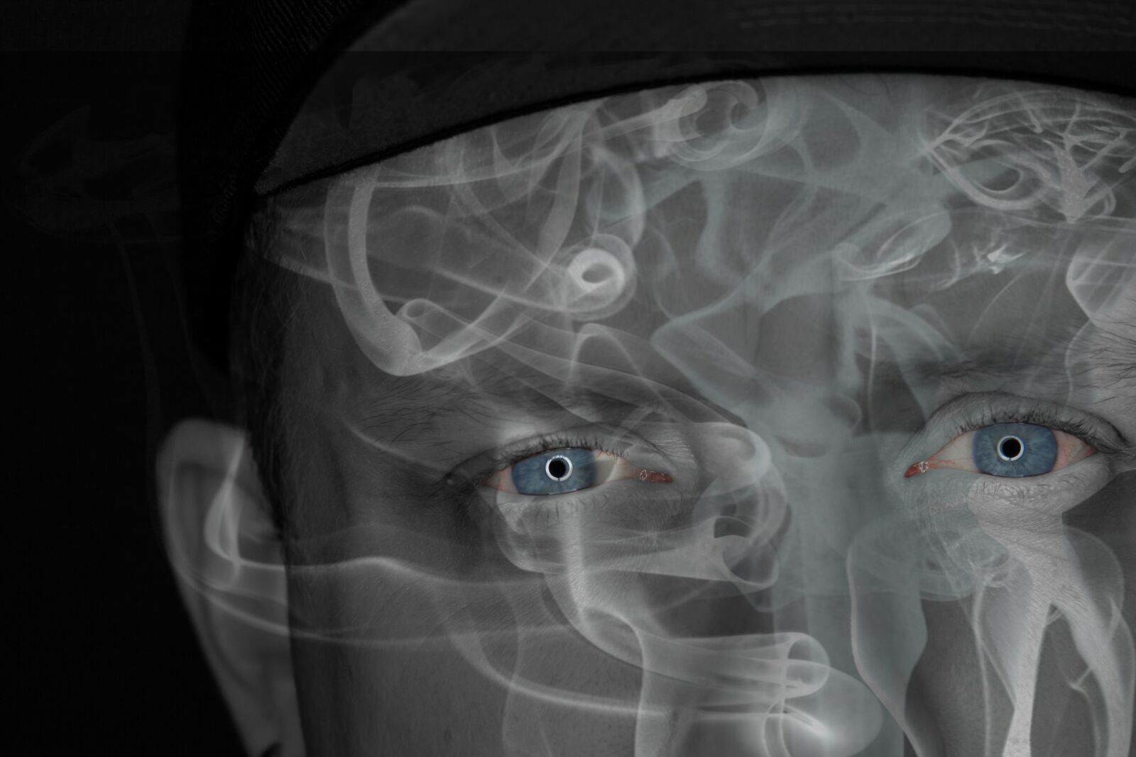 Canon EF-S 17-85mm F4-5.6 IS USM sample photo. Eyes, smoke, man photography