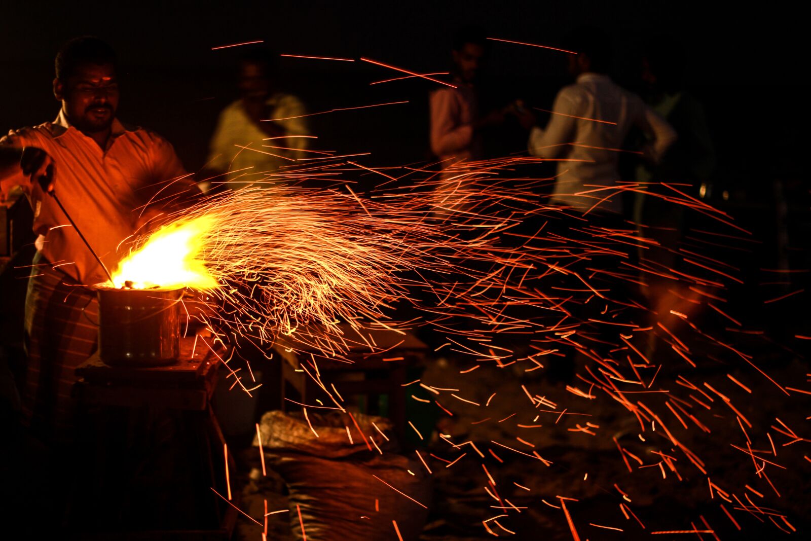 Canon EF 50mm F1.8 II sample photo. Low shutter, fire, streets photography
