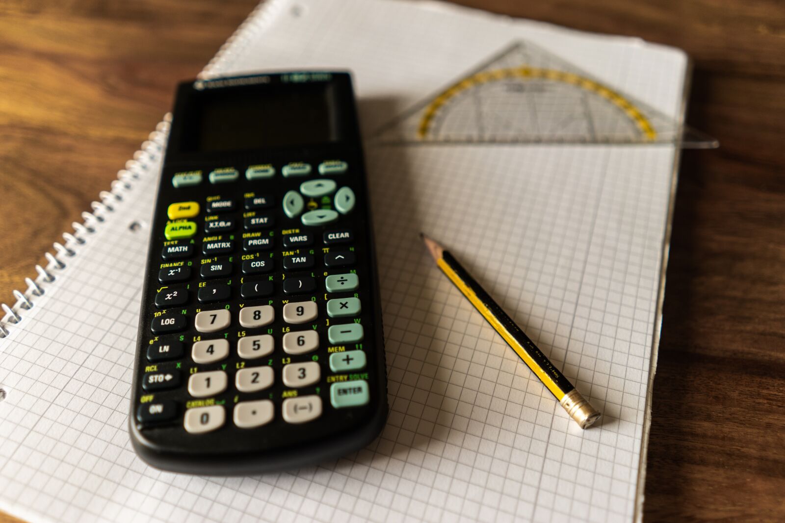 Sony a7 + Sony FE 28mm F2 sample photo. Calculator, writing pad, writing photography