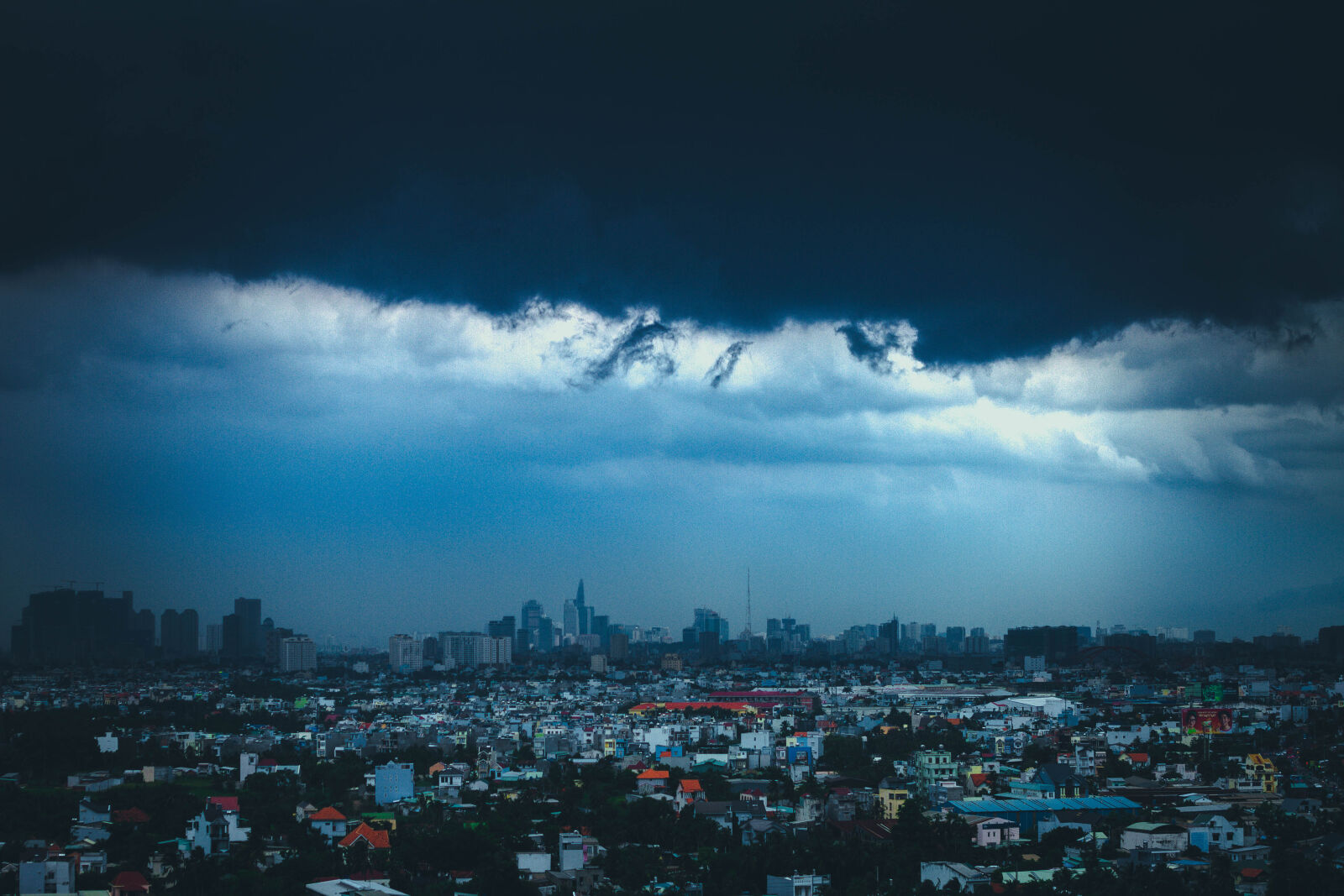 Canon EOS 7D + Canon EF 50mm F1.8 II sample photo. City, skyline, under, blue photography