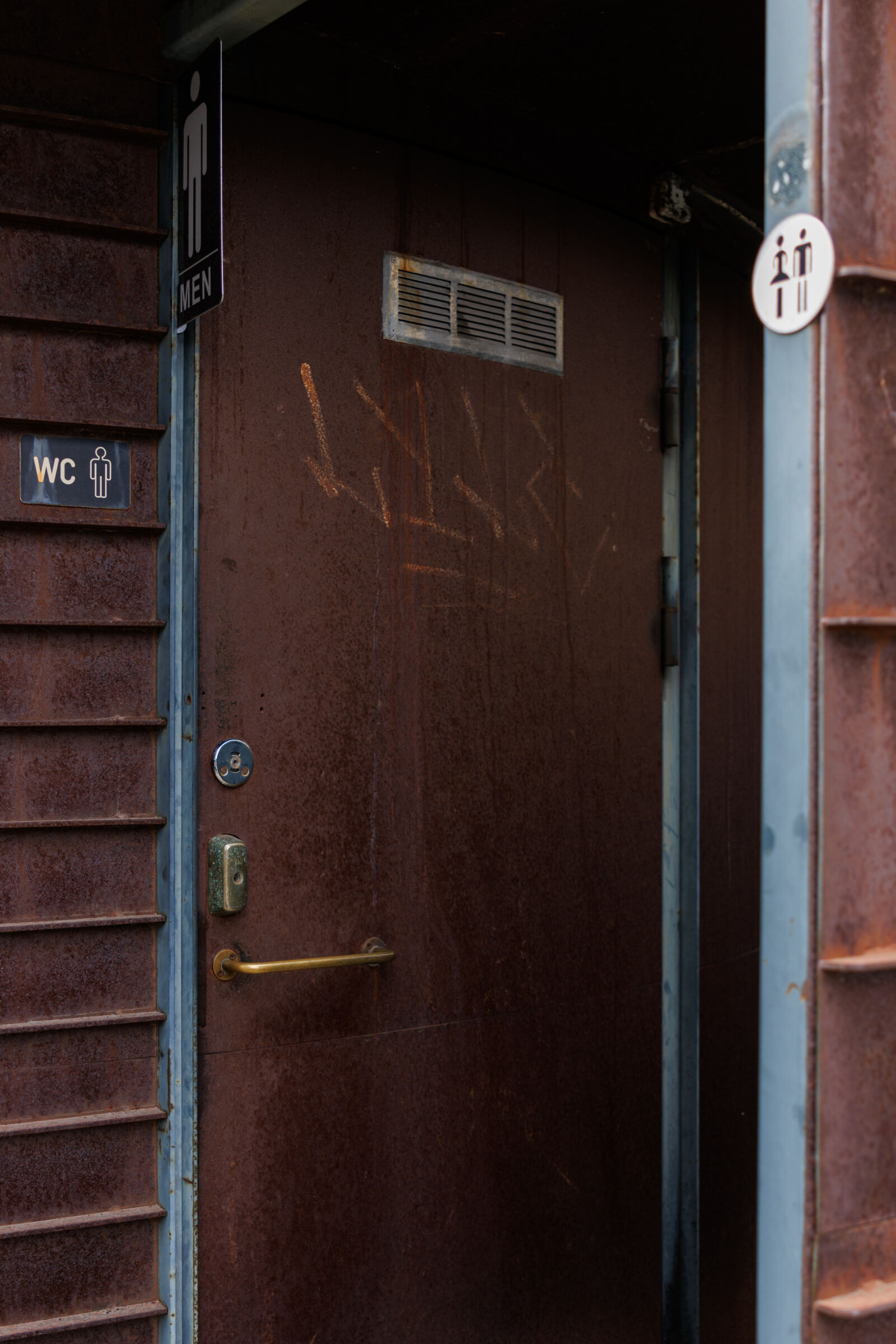 Canon EOS R7 sample photo. Metal toilet doorway photography