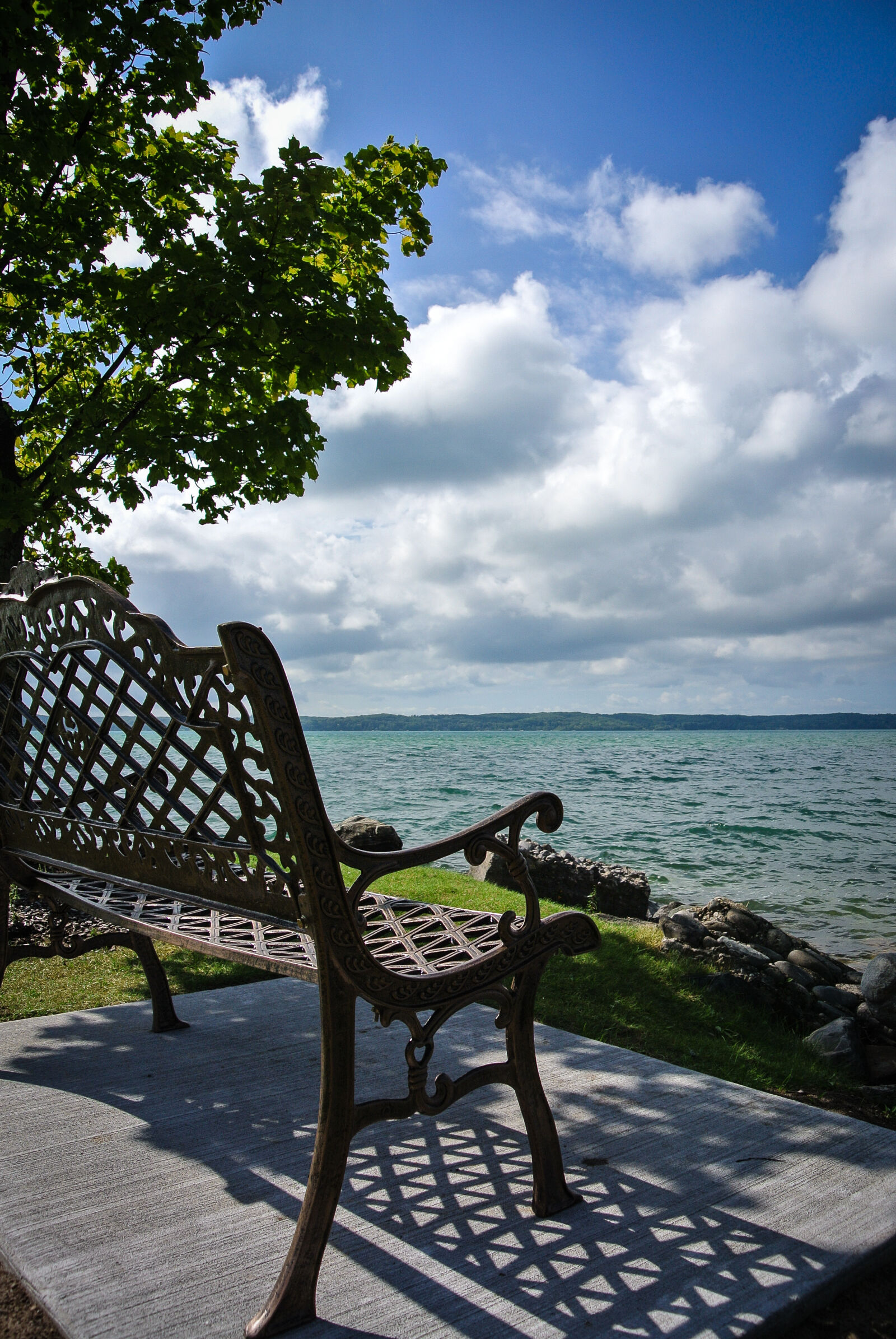 Nikon 1 Nikkor VR 10-30mm F3.5-5.6 sample photo. Alden, michigan, bench, blue photography