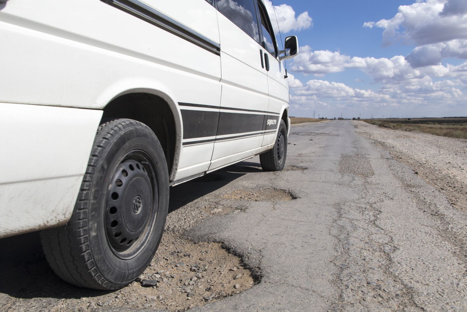 Canon EF-S 18-135mm F3.5-5.6 IS USM sample photo. Pothole, road, kazakhstan photography