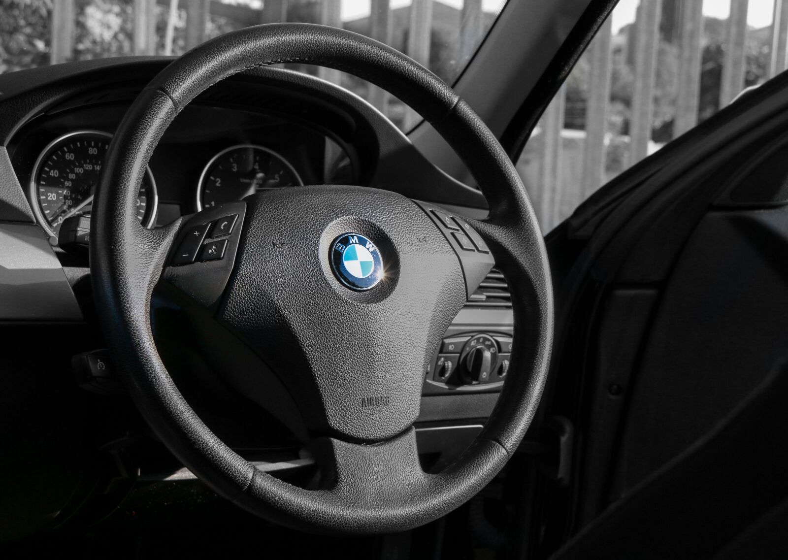 Canon EF-S 18-200mm F3.5-5.6 IS sample photo. Bmw, steering wheel, travel photography