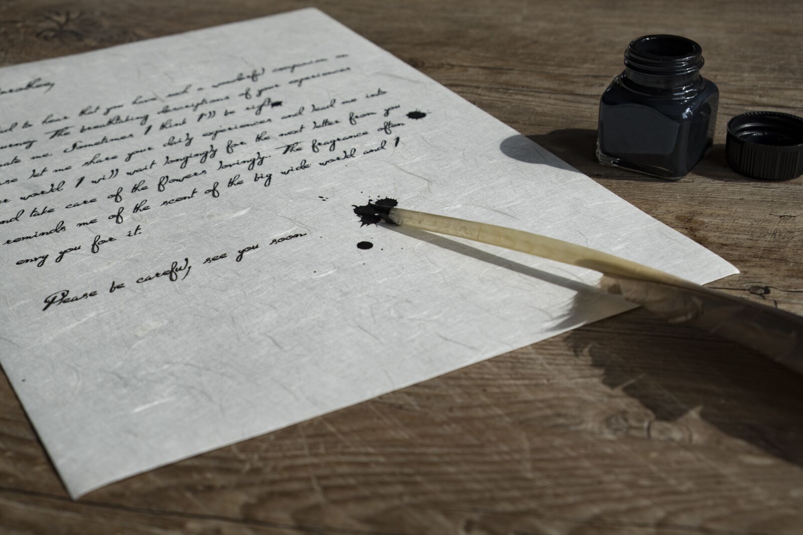 Fujifilm XF 18-55mm F2.8-4 R LM OIS sample photo. Bird feather, feather, paper photography