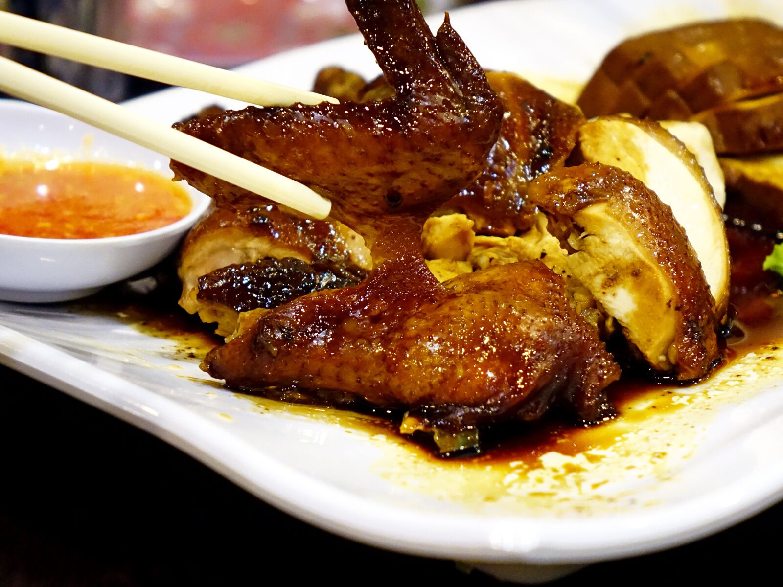 Sony Cyber-shot DSC-RX10 sample photo. Soya sauce chicken, dark photography
