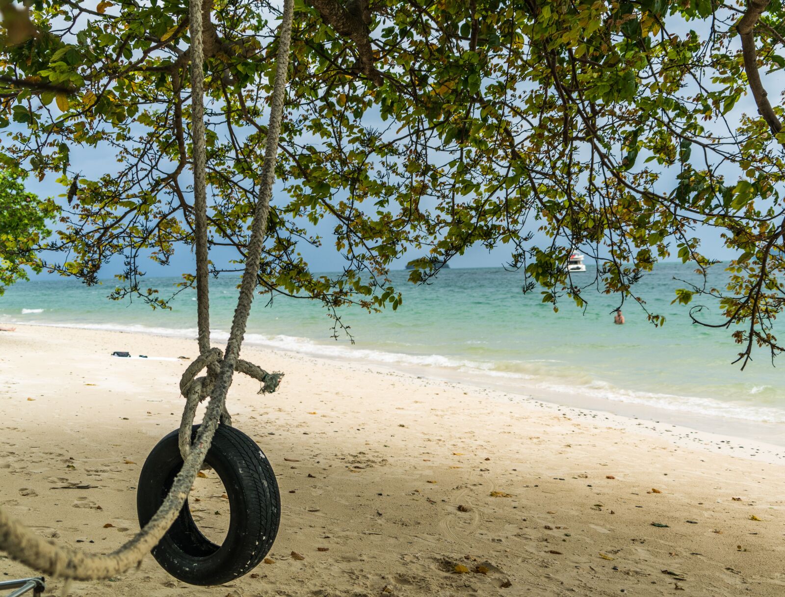 Sony a7R II + Sony FE 24-240mm F3.5-6.3 OSS sample photo. Tire swing, beach, summer photography