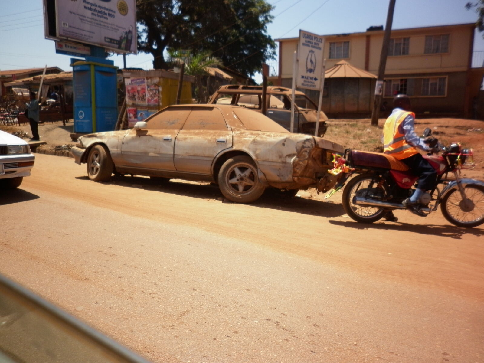 Panasonic DMC-F3 sample photo. Africa, car, dirt, poverty photography