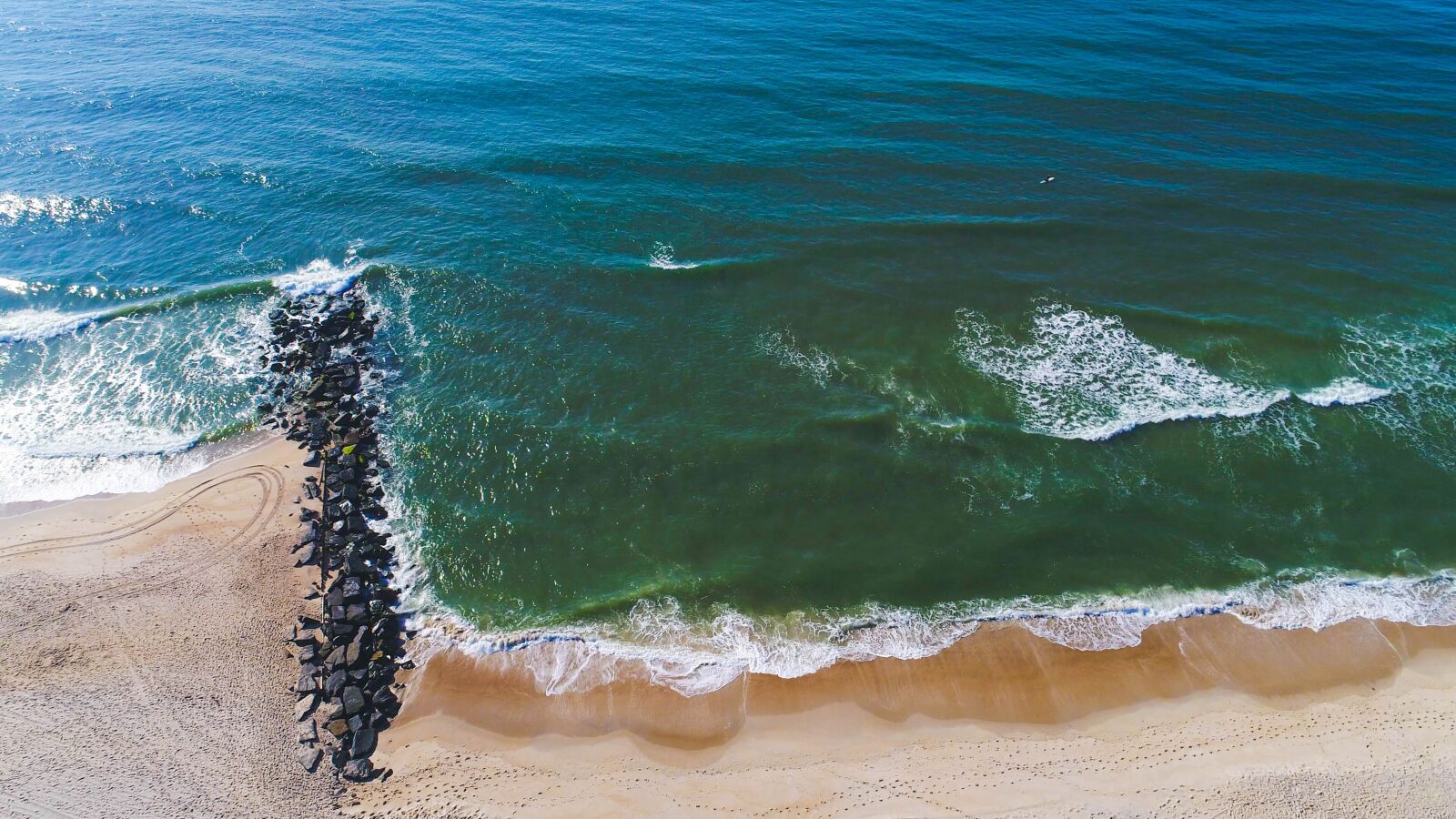 DJI FC6310 sample photo. Lbi, jetty, surf photography
