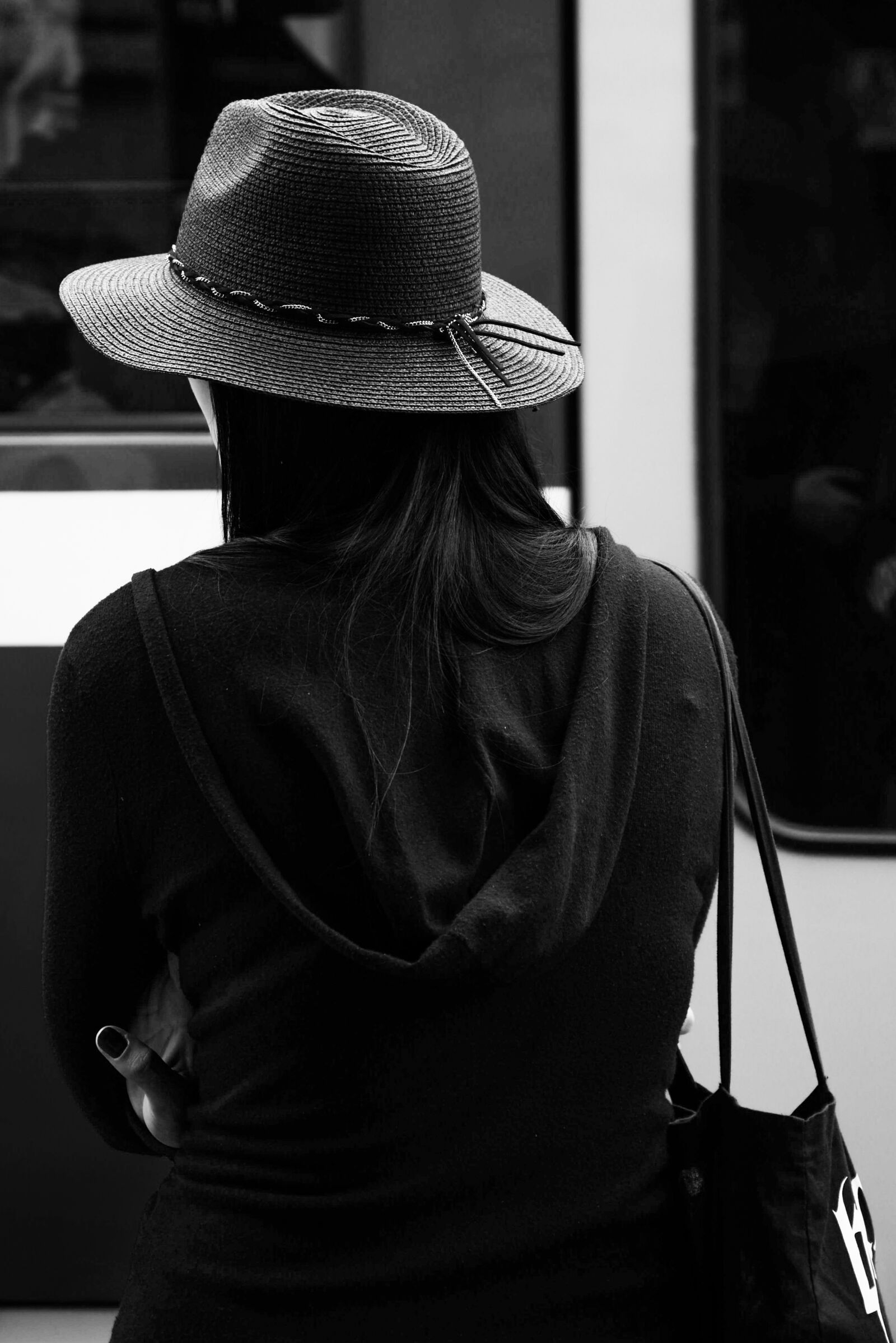 Nikon AF-S Nikkor 24-85mm F3.5-4.5G ED VR sample photo. Woman, hat, black and photography