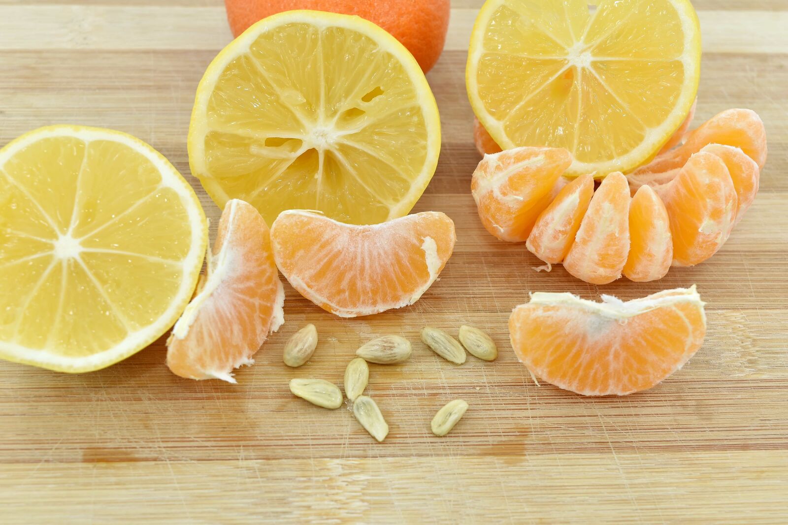 Nikon D5500 sample photo. Lemon, mandarin, seed, slices photography