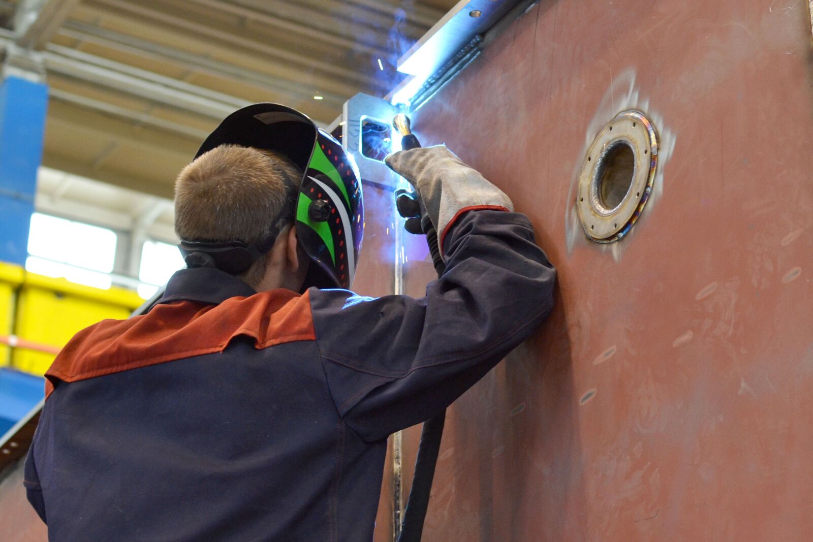 Nikon D3100 sample photo. Welder, plant, people photography