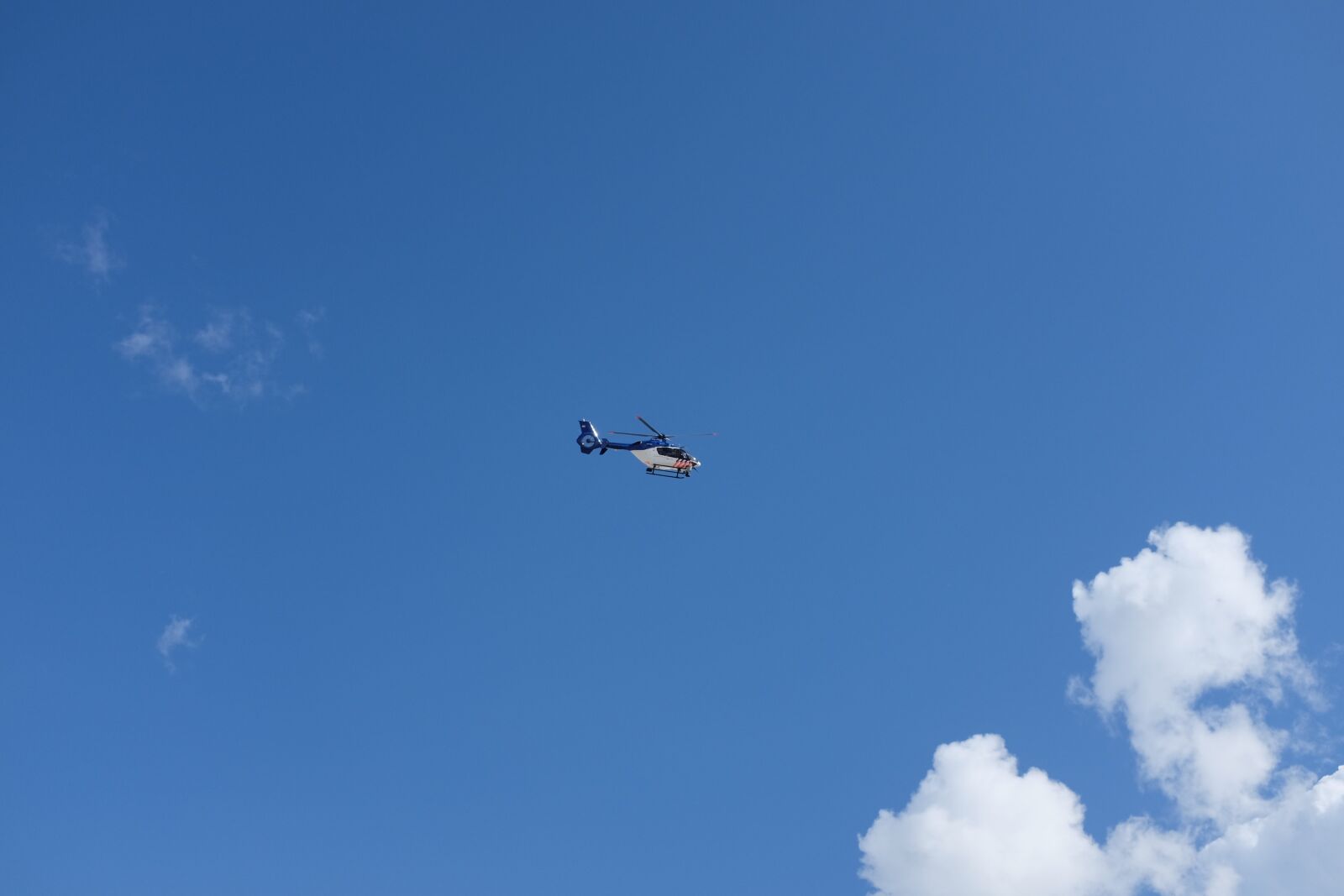 Fujifilm X100S sample photo. Sky, clouds, helicopter photography