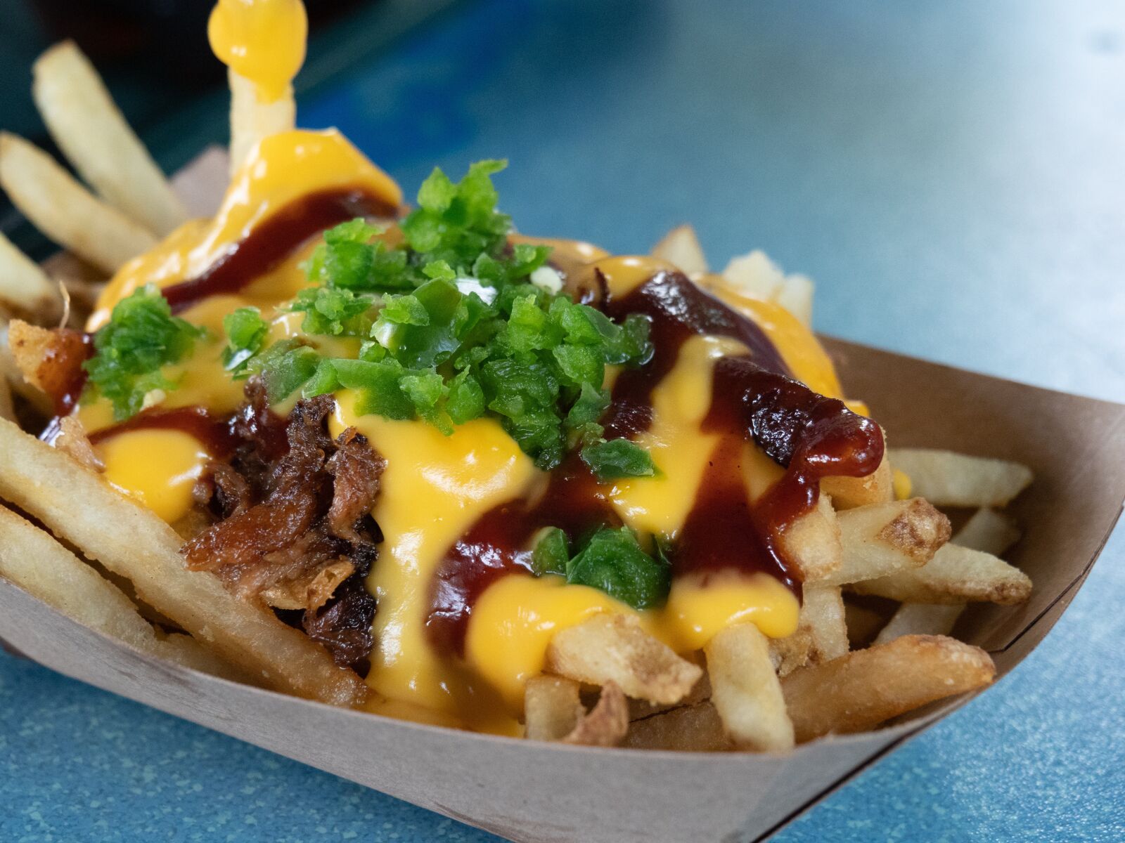 Olympus OM-D E-M1 Mark II sample photo. French fries, cheese, pork photography